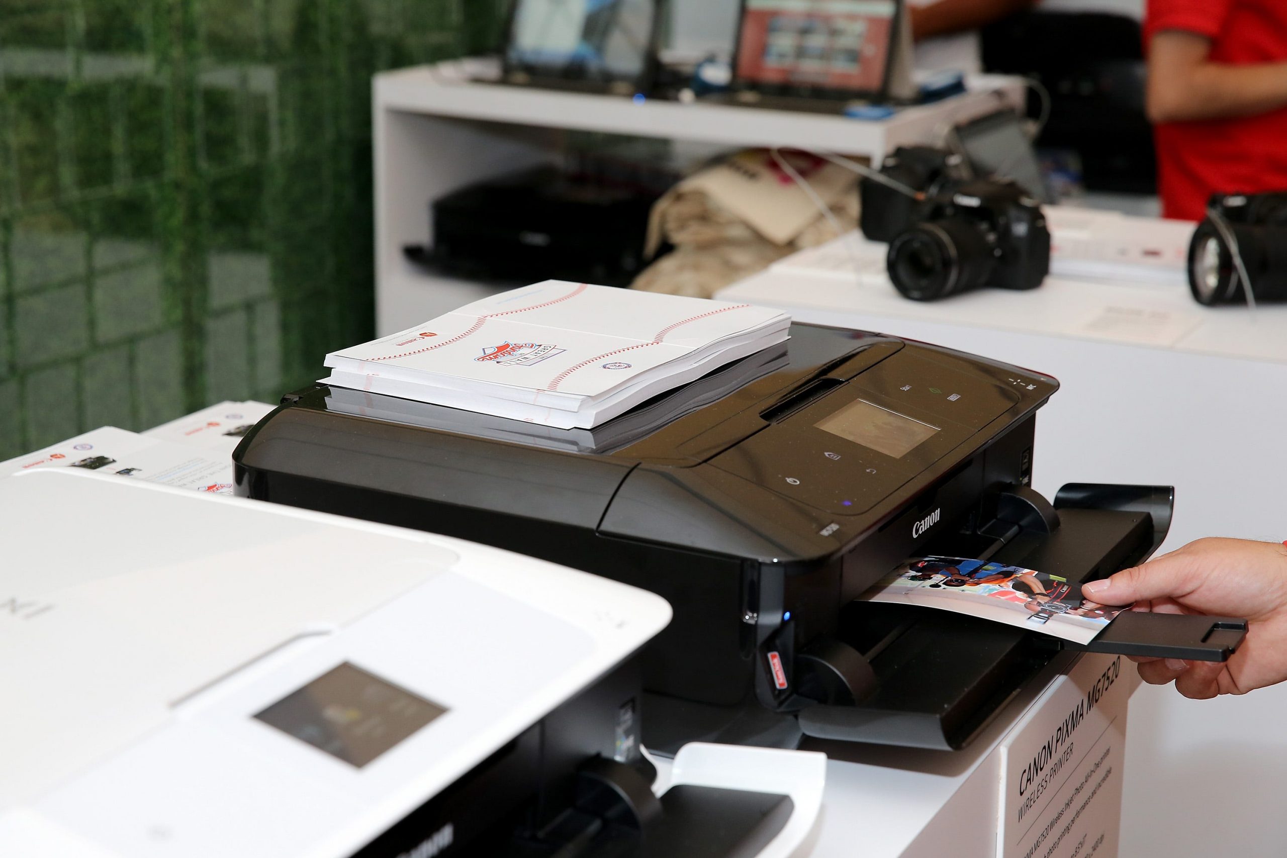 A Canon PIXMA printer on display at a booth