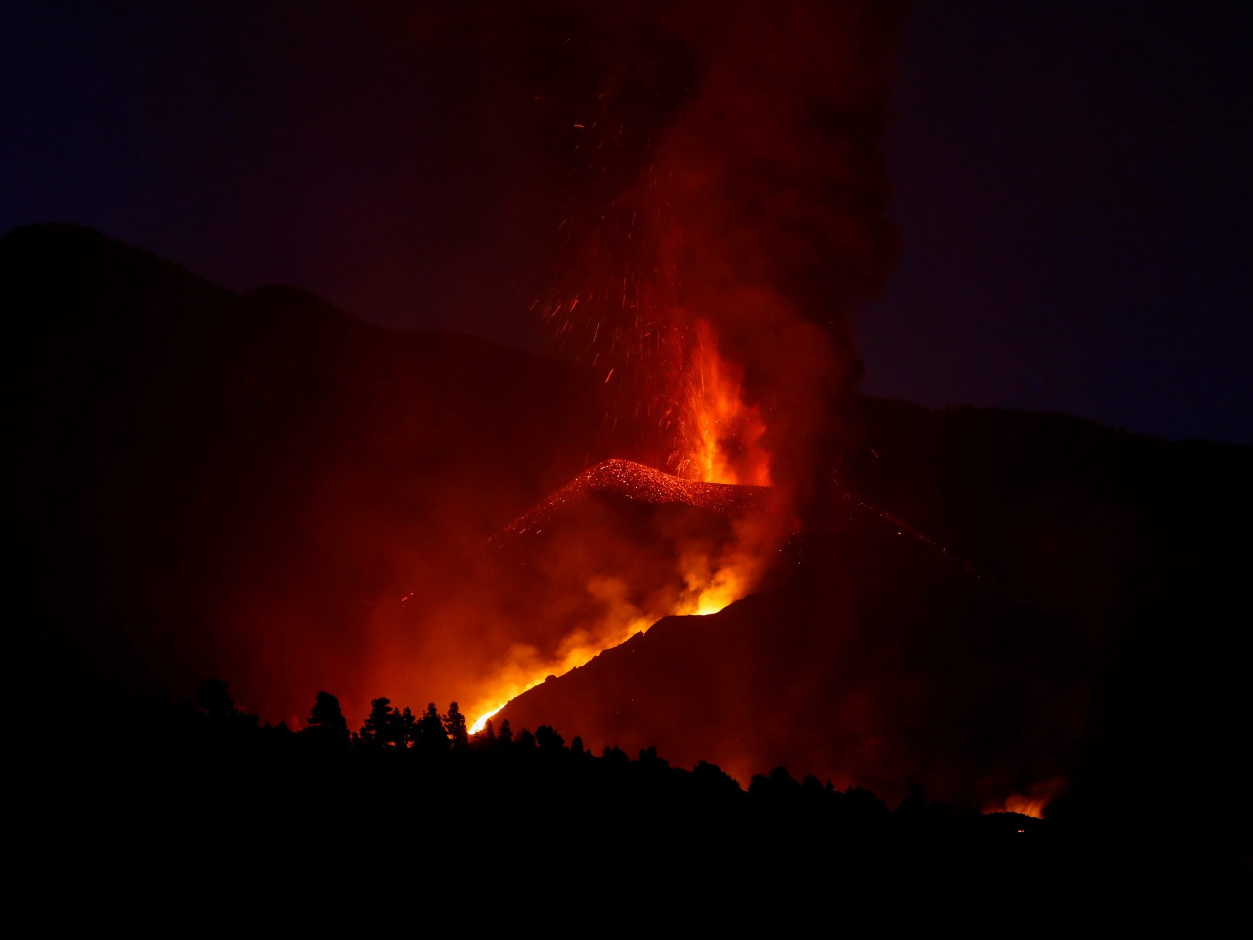 The Cumbre Vieja volcano spews lava as it continues to erupt on the Canary Island of La Palma, as seen from Tajuya, Spain, October 17, 2021