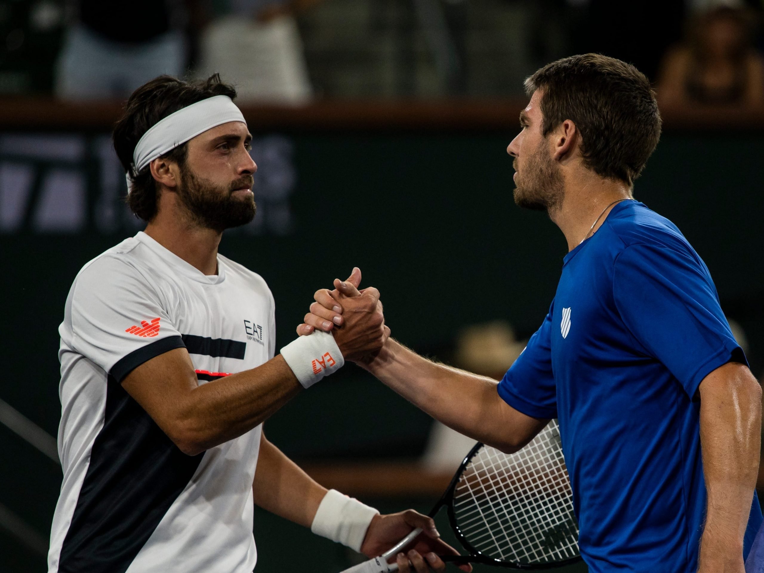 Cameron Norrie of Great Britain shakes hands with Nikoloz Basilashvili of Georgia