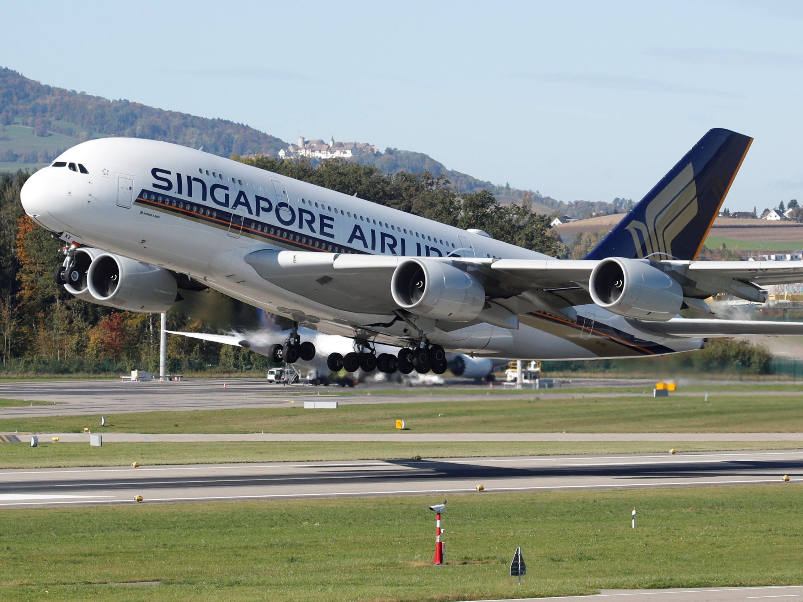 FILE PHOTO: An Airbus A380-800 aircraft of Singapore Airlines takes off from Zurich airport, Switzerland October 16, 2019.  REUTERS/Arnd Wiegmann/File Photo