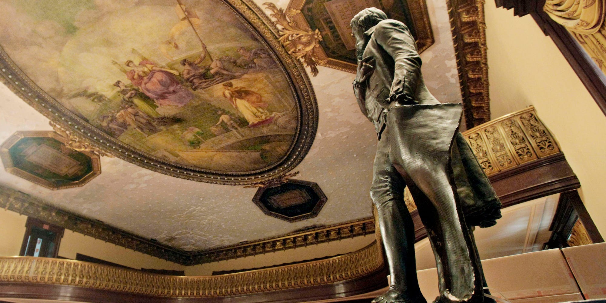 In this July 14, 2010, file photo, a statue of Thomas Jefferson, right, stands in New York's City Hall Council Chamber.