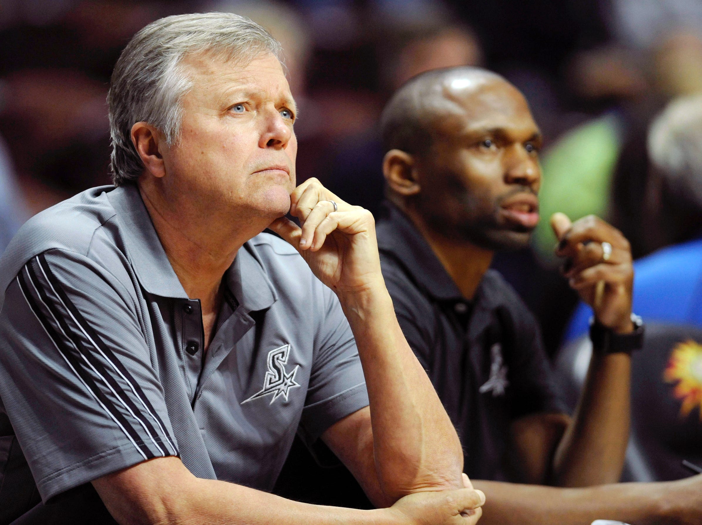 Dan Hughes and James Wade sit on the bench for the San Antonio Stars.