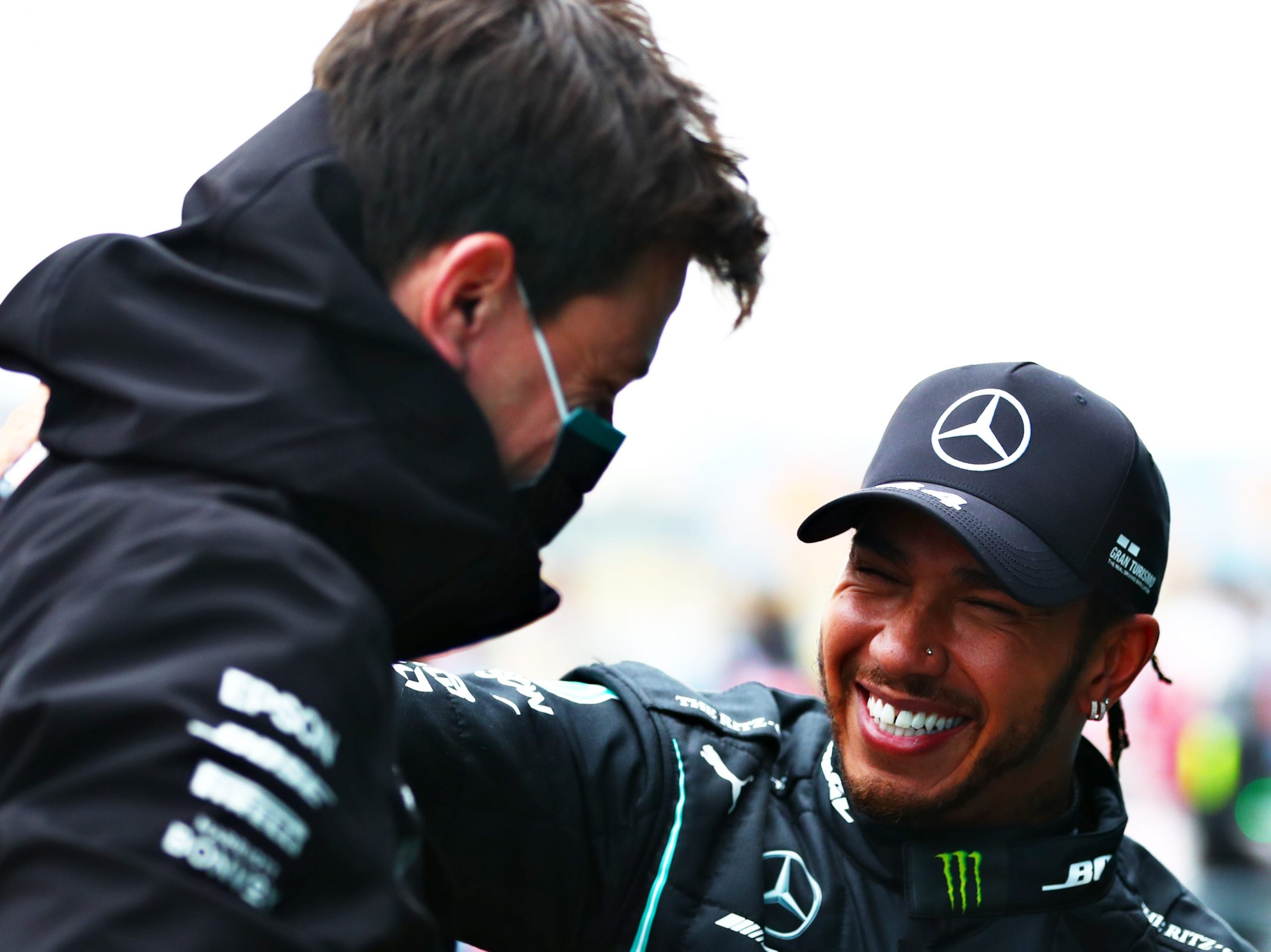 Lewis Hamilton smiles at Toto Wolff