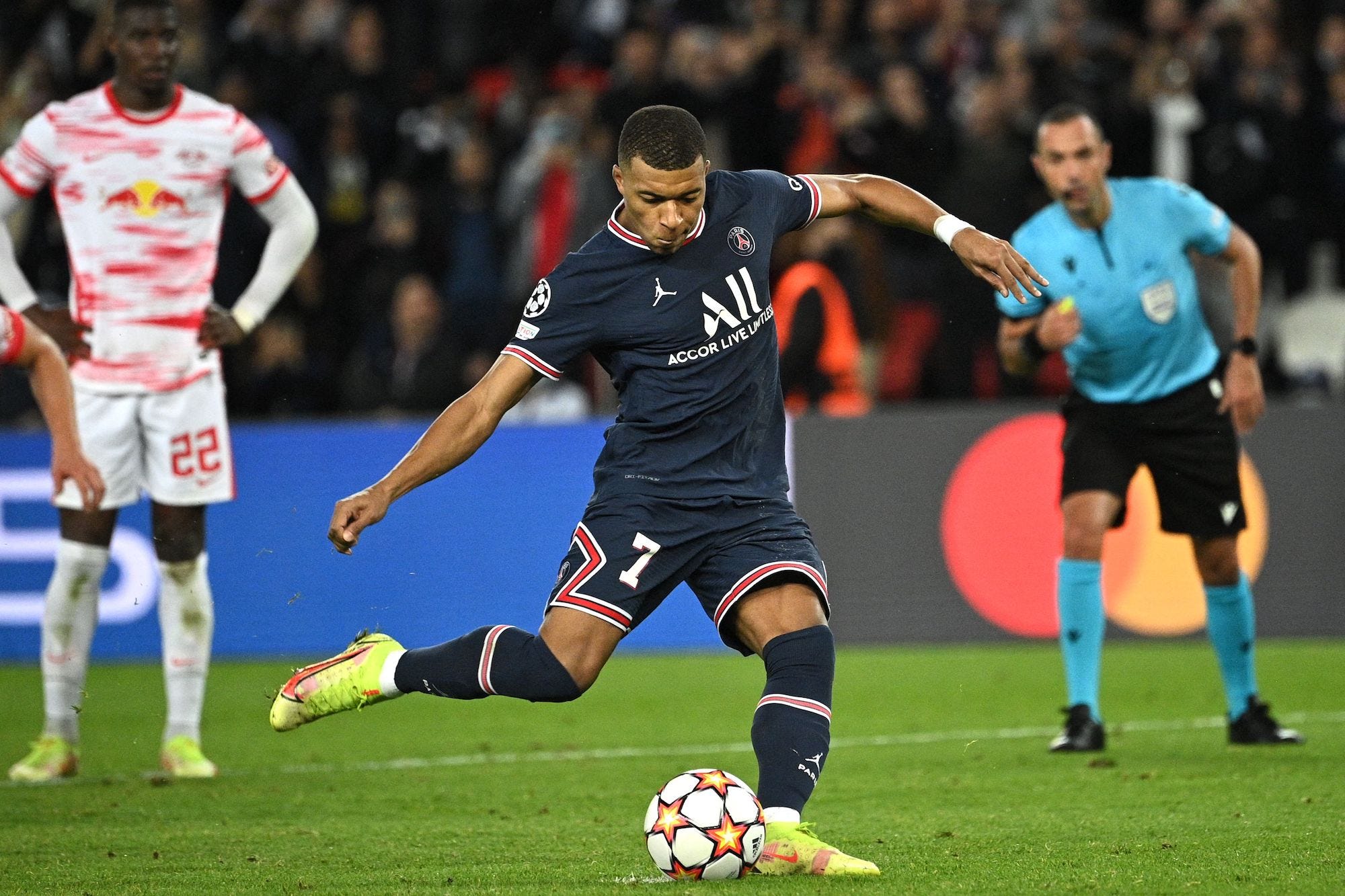 Paris Saint-Germain's French forward Kylian Mbappe kicks a penalty shot during the UEFA Champions League first round Group A football match between Paris Saint-Germain and RB Leipzig