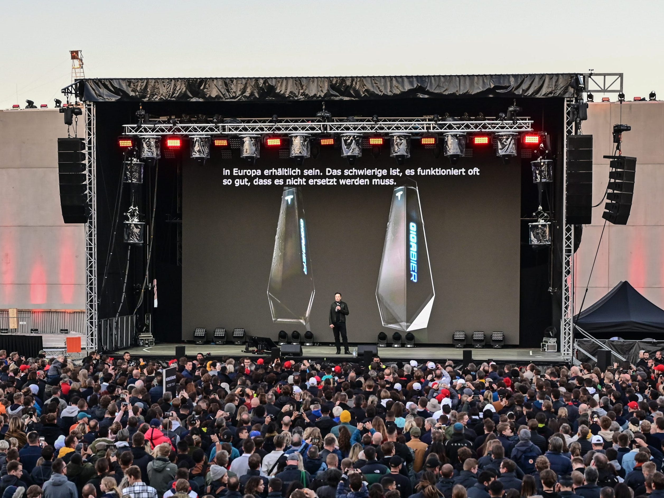 Tesla CEO Elon Musk reveals "Giga Beer" in a cyber-truck inspired bottle at the Giga Fest in Germany.