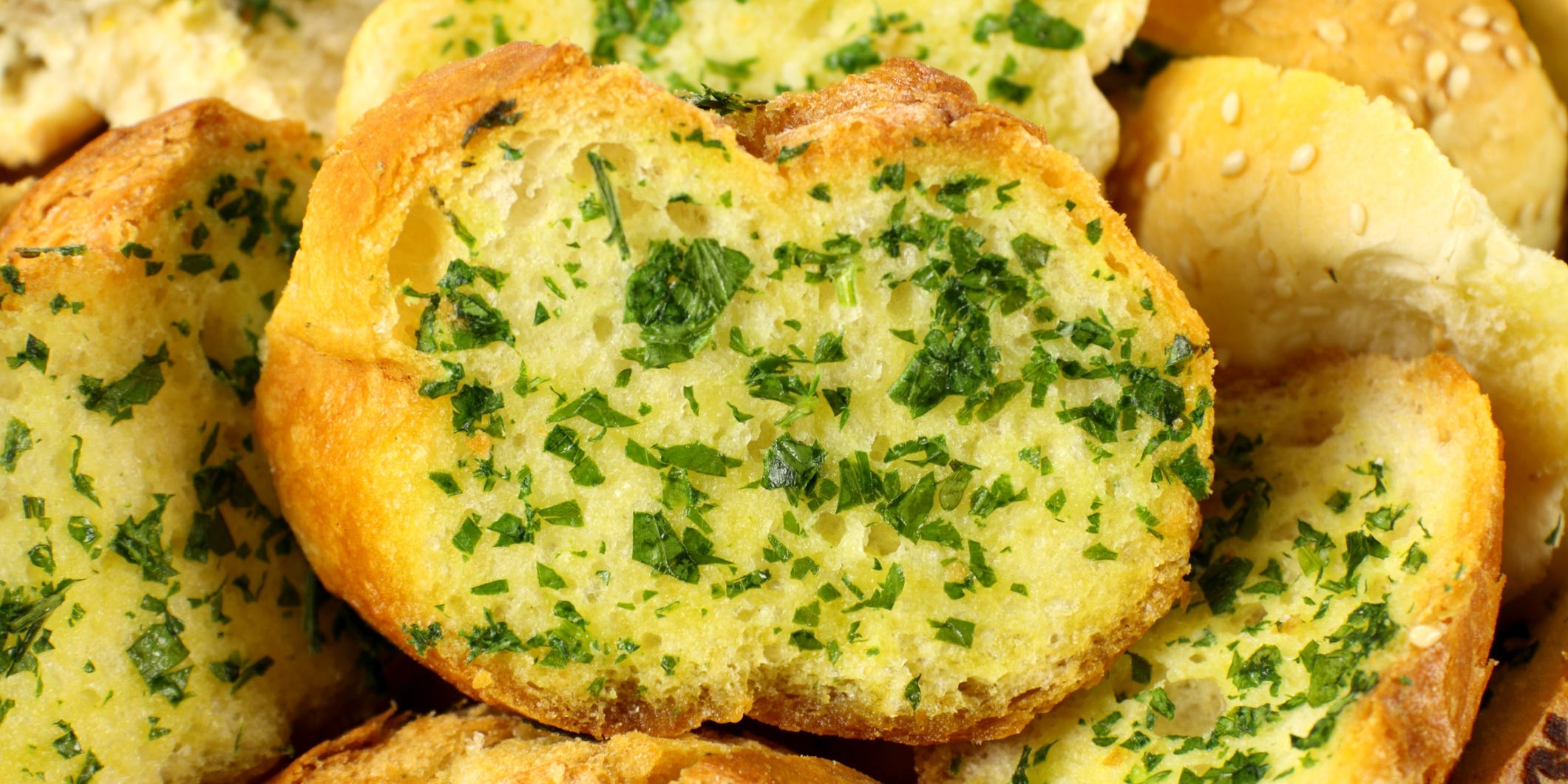 Slices of herbed garlic bread