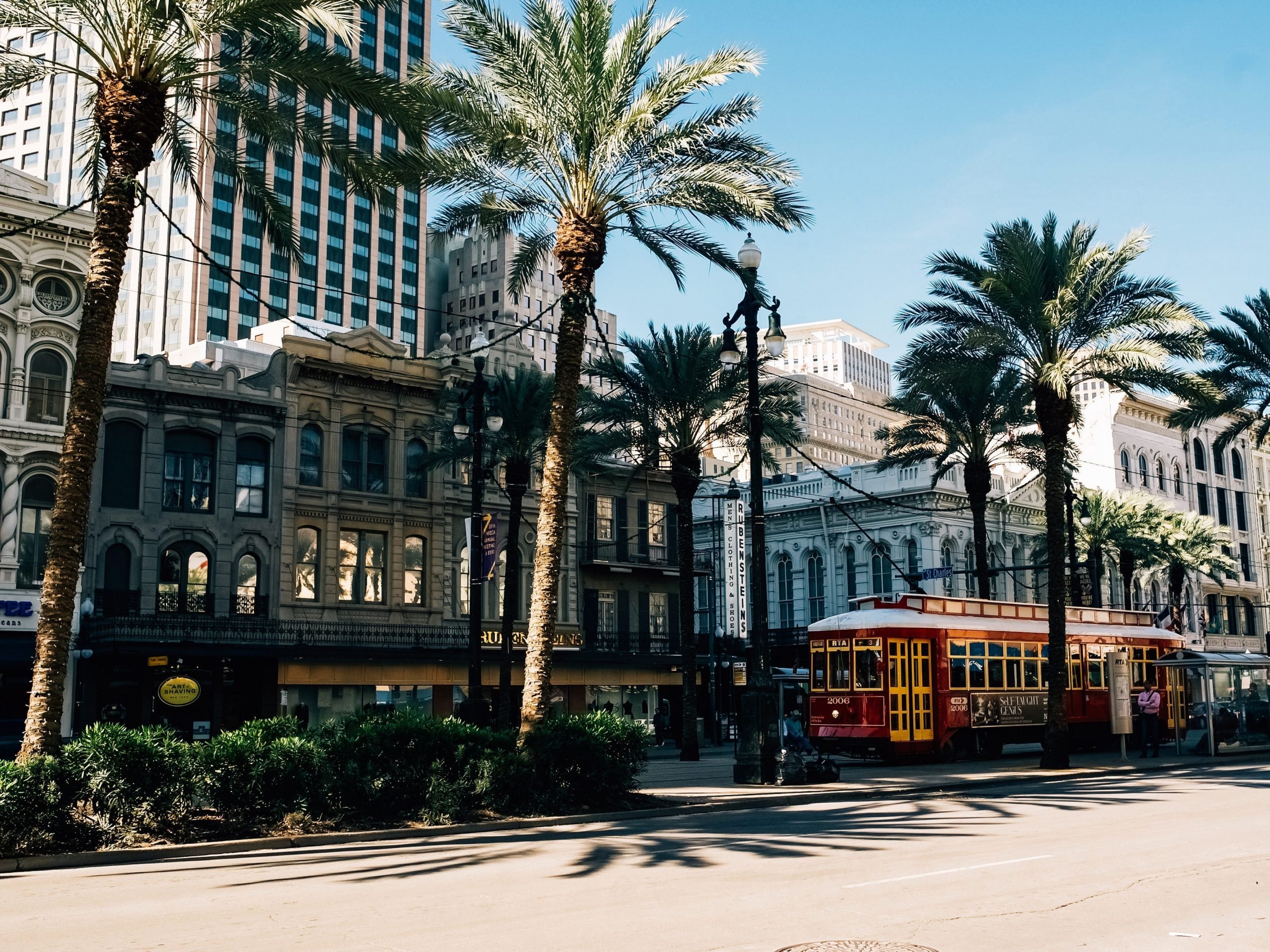 A streetcar drives through the heart of New Orleans