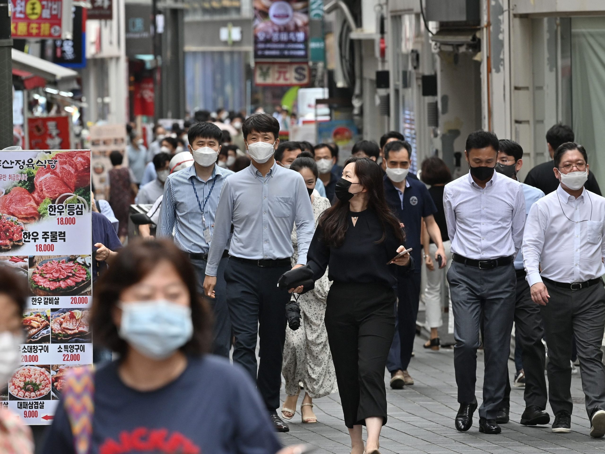 pedestrians myeongdong seoul south korea office workers