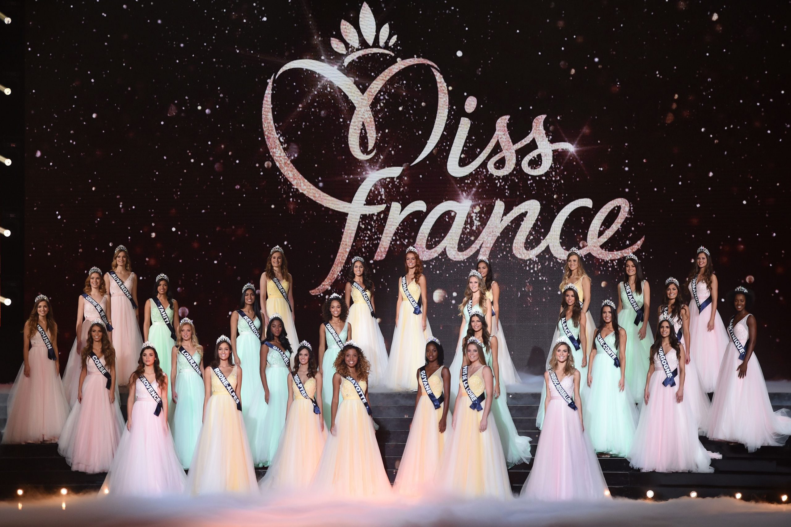 Contestants pose on stage during the Miss France 2018 pageant in Chateauroux, central France, on December 16, 2017.