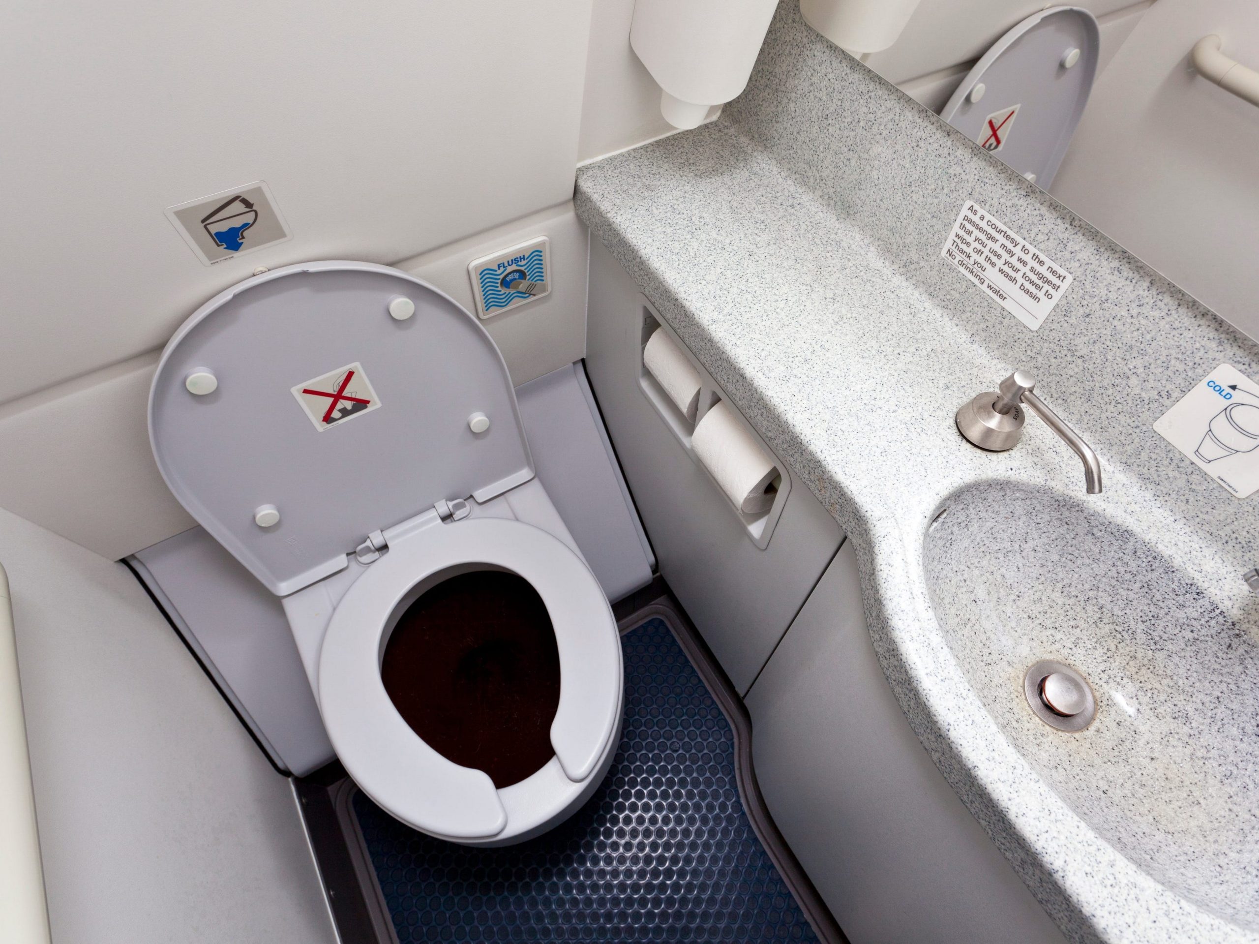 A stock photo of a plane toilet.