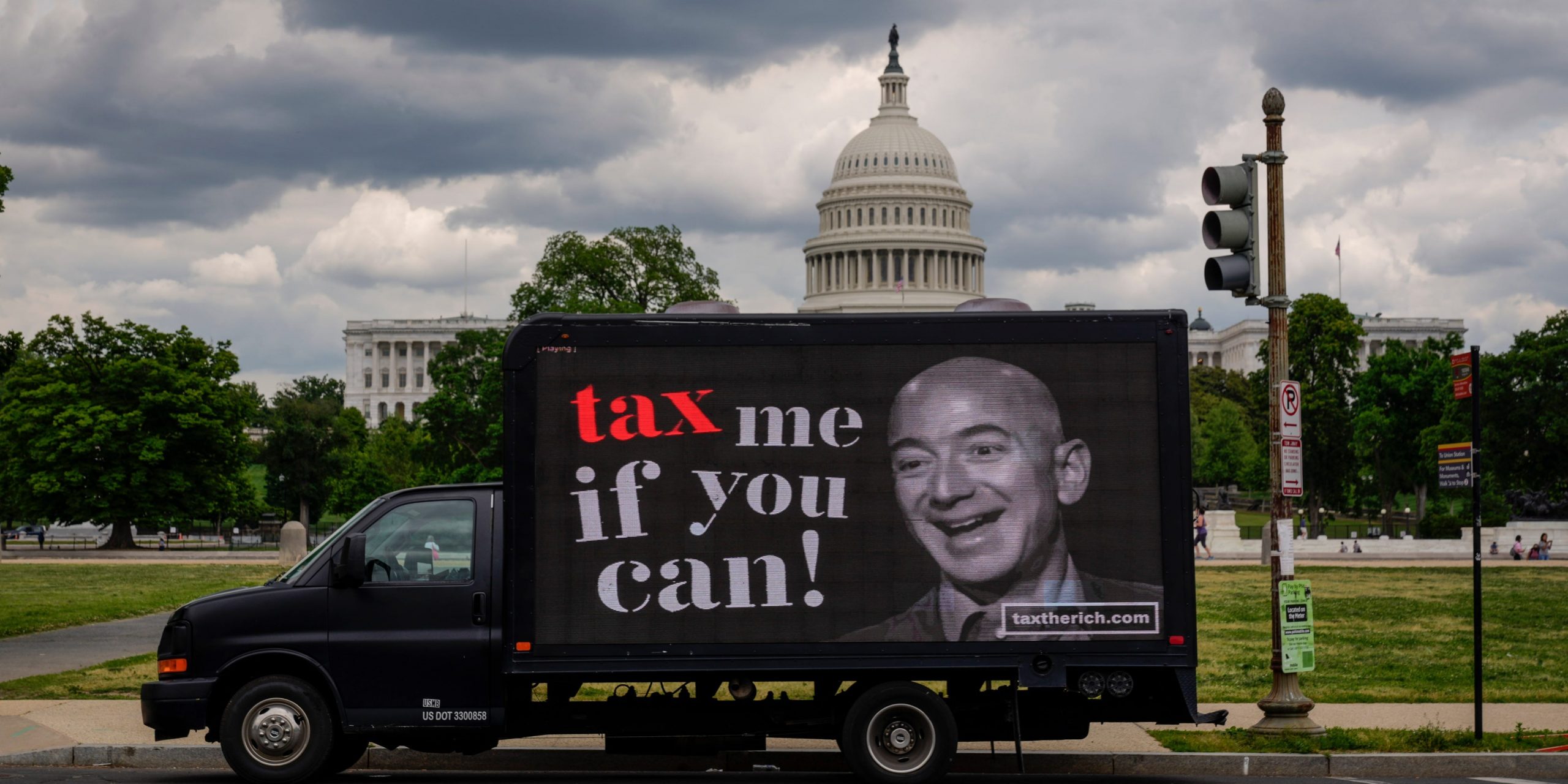 A mobile billboard calling for higher taxes on the ultra-wealthy depicts an image of billionaire businessman Jeff Bezos, near the U.S. Capitol on May 17, 2021 in Washington, DC. Organized by the group "Patriotic Millionaires," the mobile billboards are rolling through Washington, DC and New York City on Monday to mark Tax Day, calling for higher taxes for wealthy Americans.