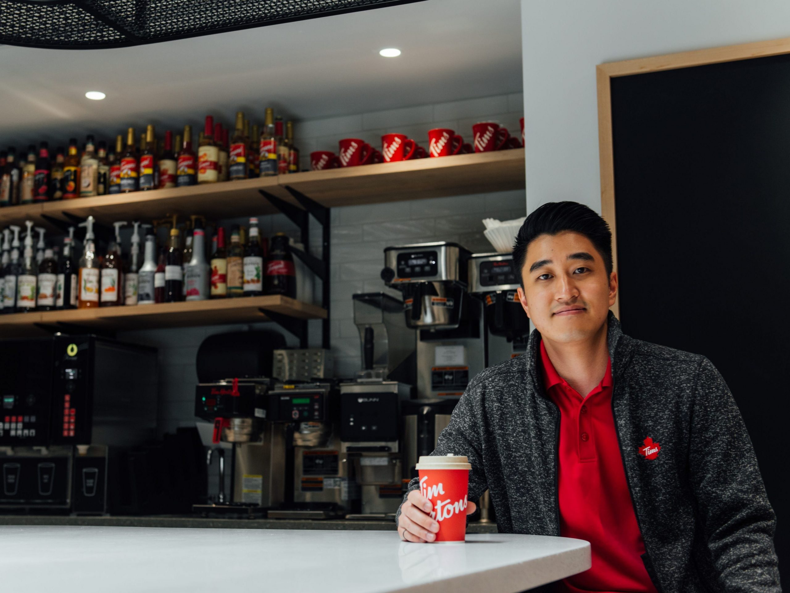 Tim Horton's senior director of sustainability and packaging, Paul Yang, with a more sustainable coffee cup in the company's head office in Toronto, Canada.