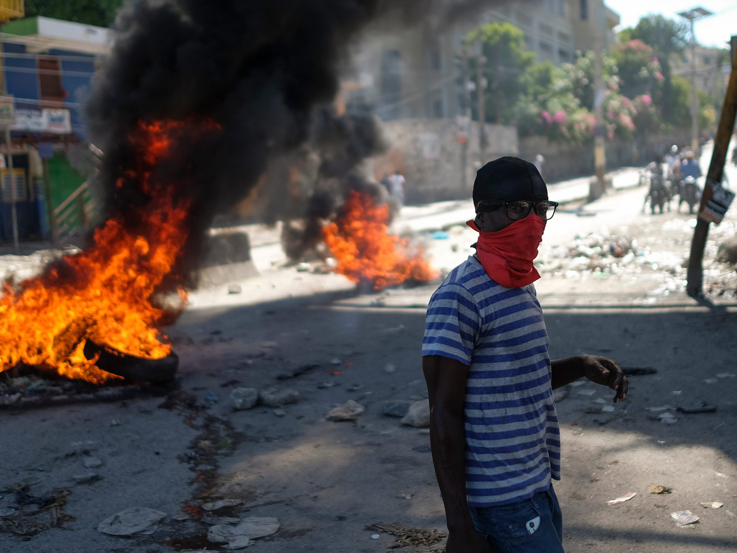 Tires burn in the street as part of an anti-government protest in Port-au-Prince, Haiti, Thursday, Oct. 21, 2021.