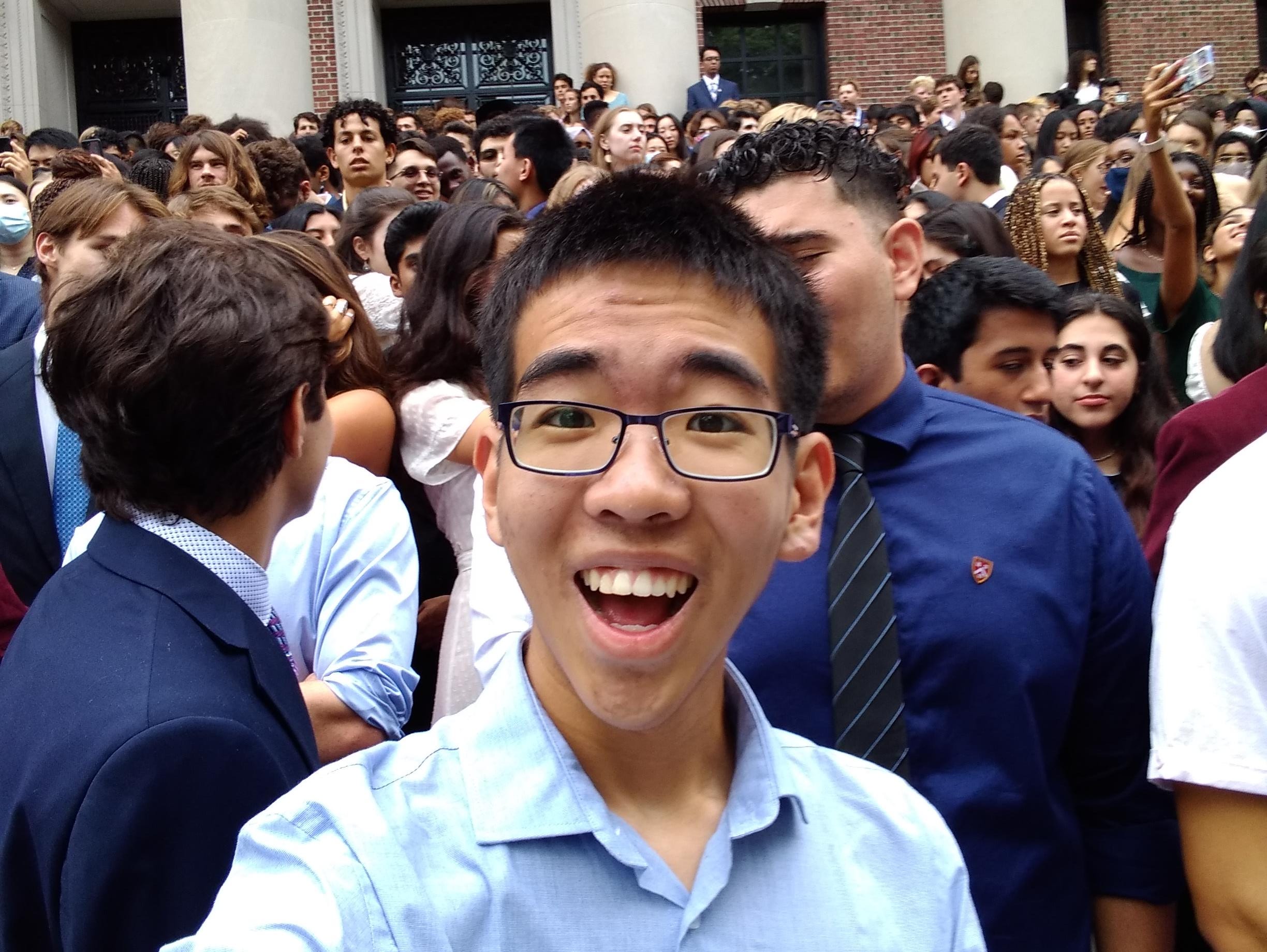 Harvard freshman Yuen Ler Chow is shown on campus surrounded by fellow students.