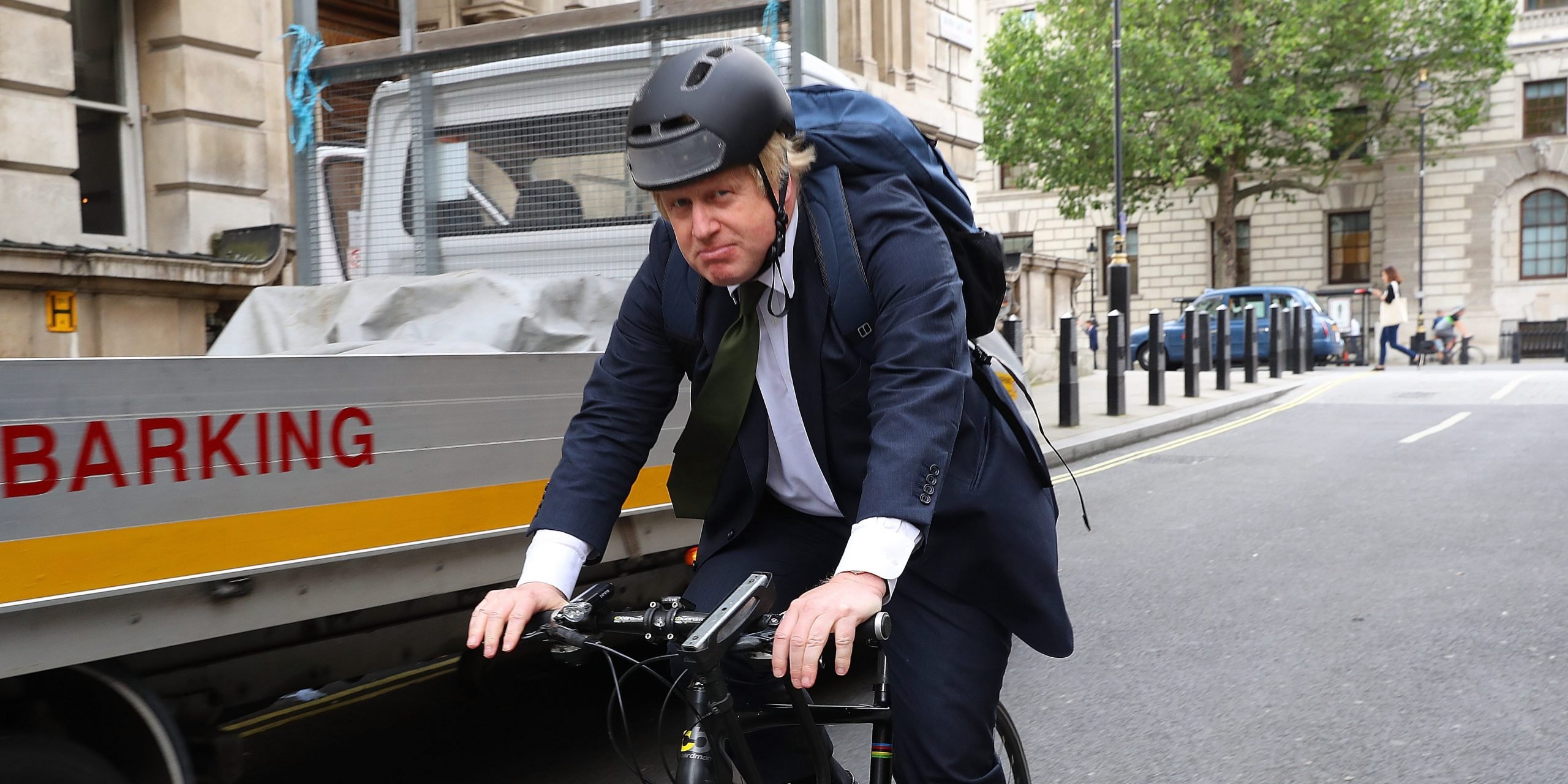 Boris Johnson riding a bicycle