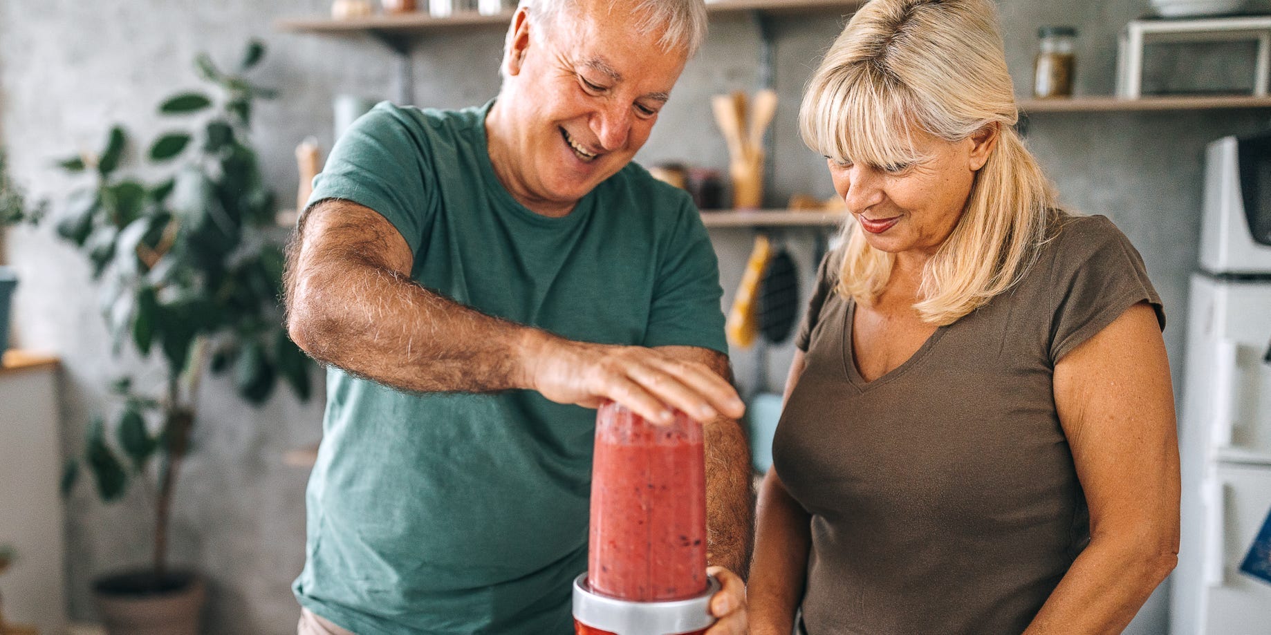 older couple making a smoothie