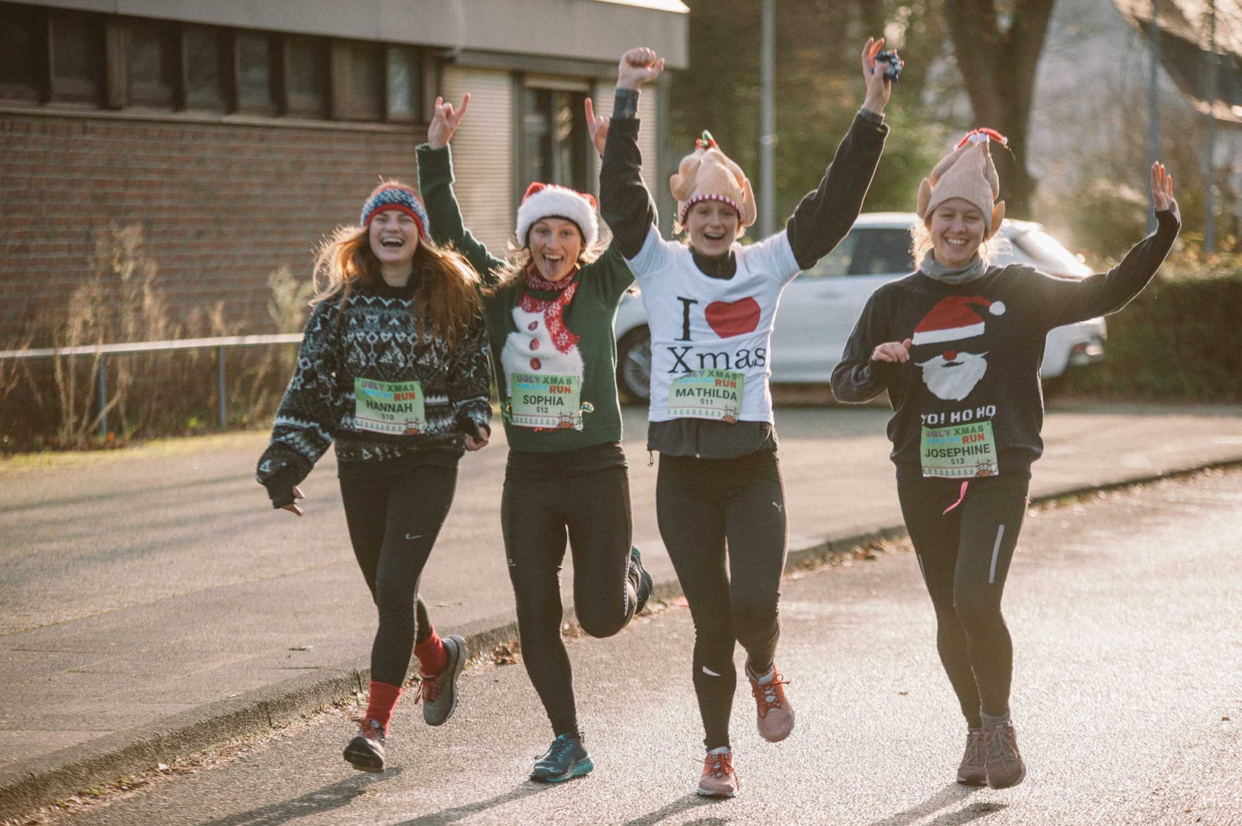 Women in Christmas sweaters run in a race in Germany