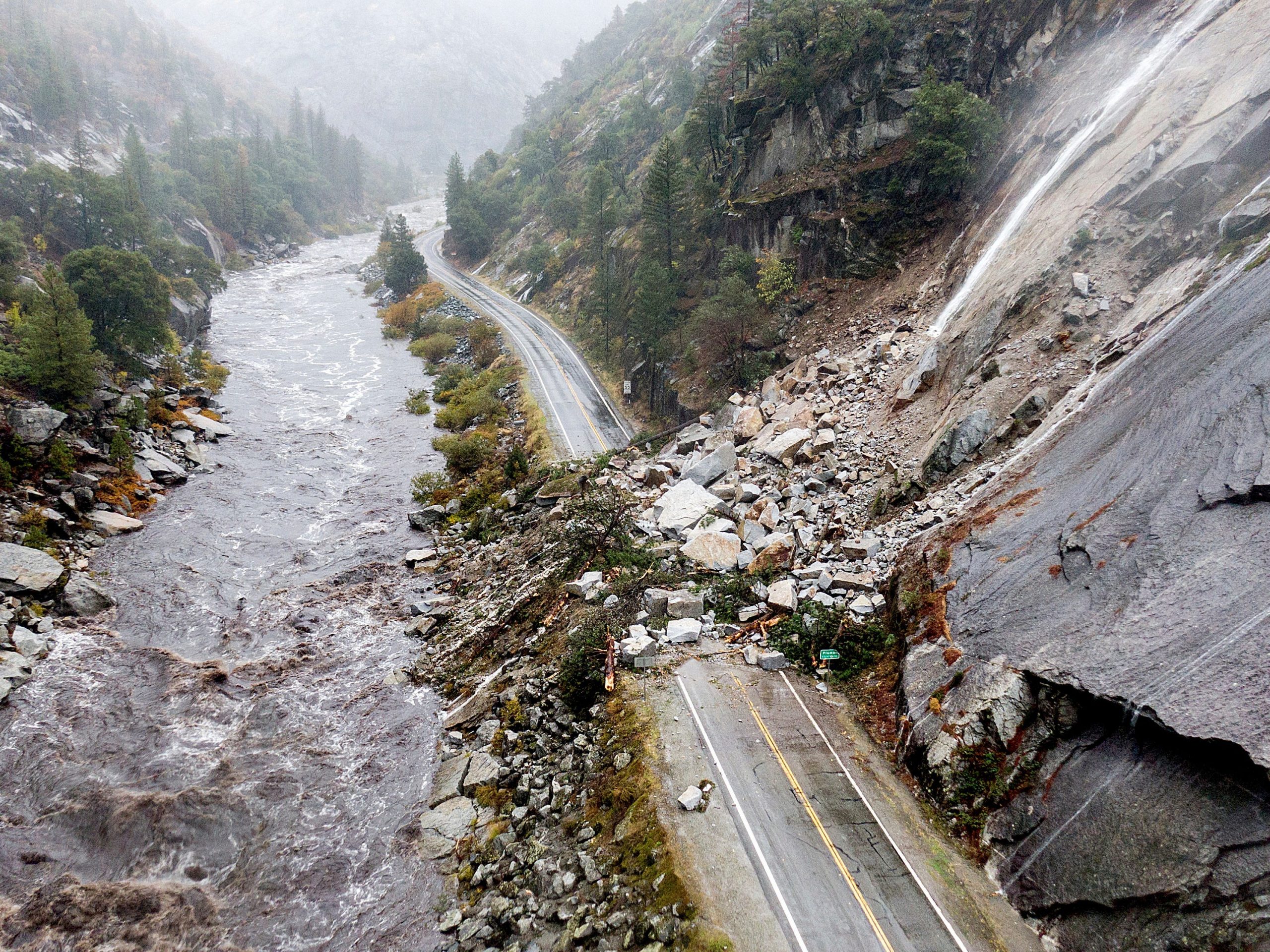 ocks and vegetation cover Highway 70 following a landslide in the Dixie Fire zone on Sunday, Oct. 24, 2021, in Plumas County, Calif.