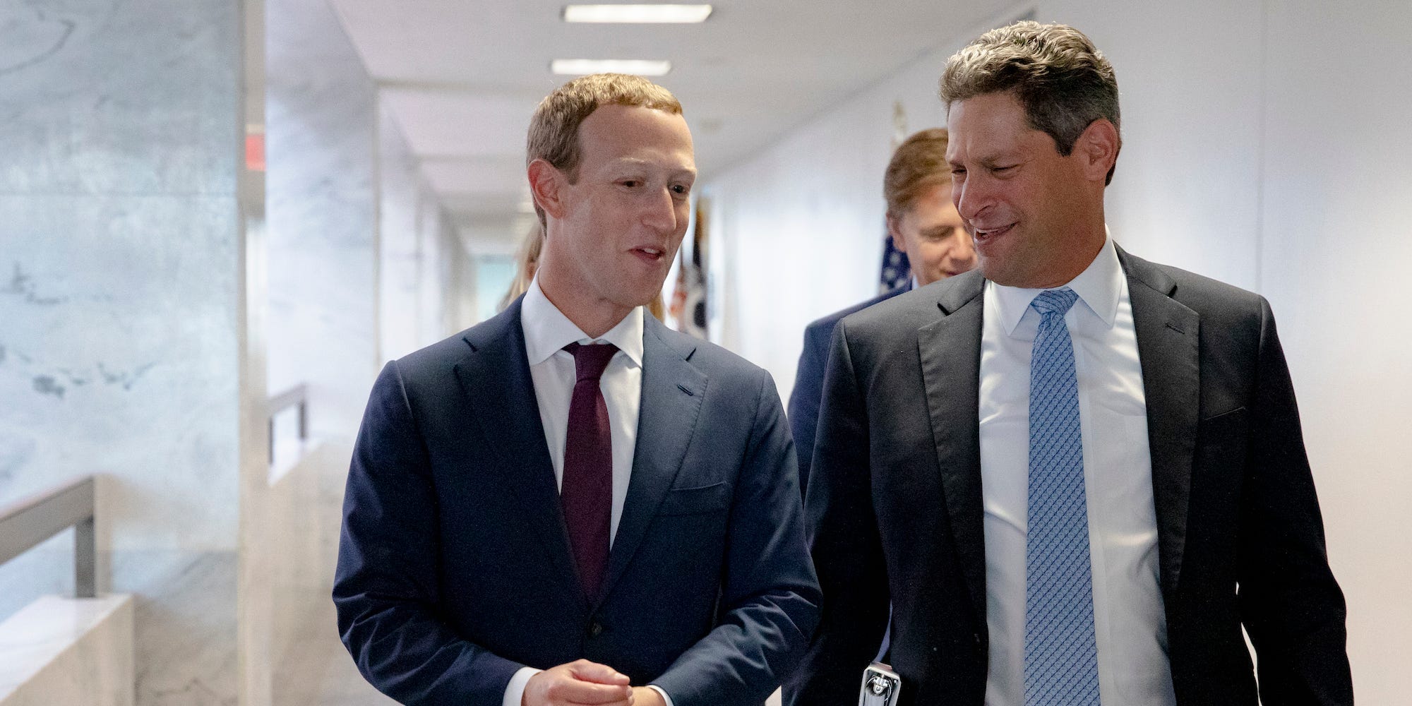 Facebook CEO Mark Zuckerberg Facebook's Vice President of Global Public Policy Joel Kaplan chat after leaving a meeting with Republican Senator John Cornyn of Texas in his office on Capitol Hill on September 19, 2019.