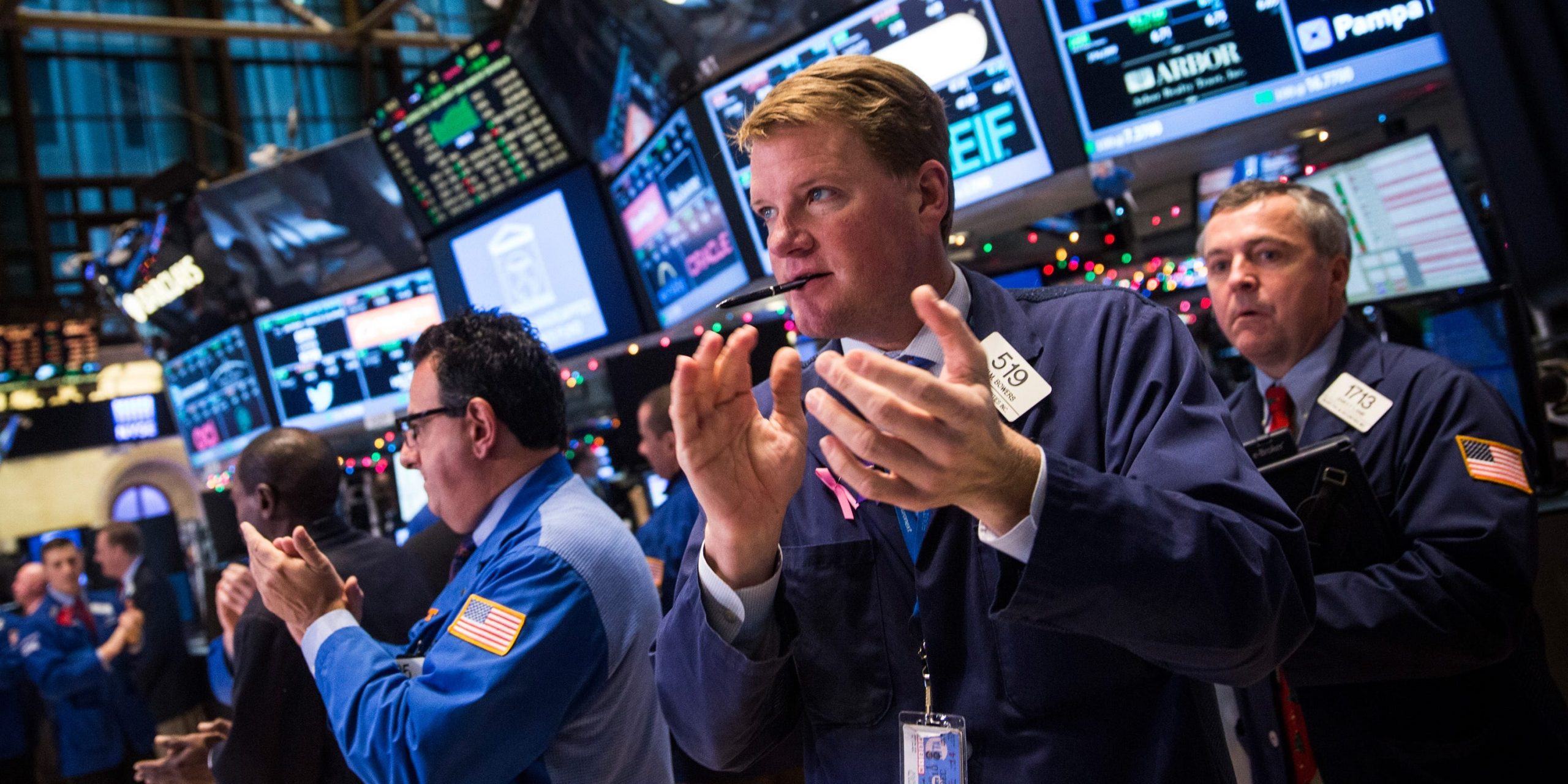 Traders work on the floor of the New York Stock Exchange during the afternoon of December 18, 2014 in New York City.