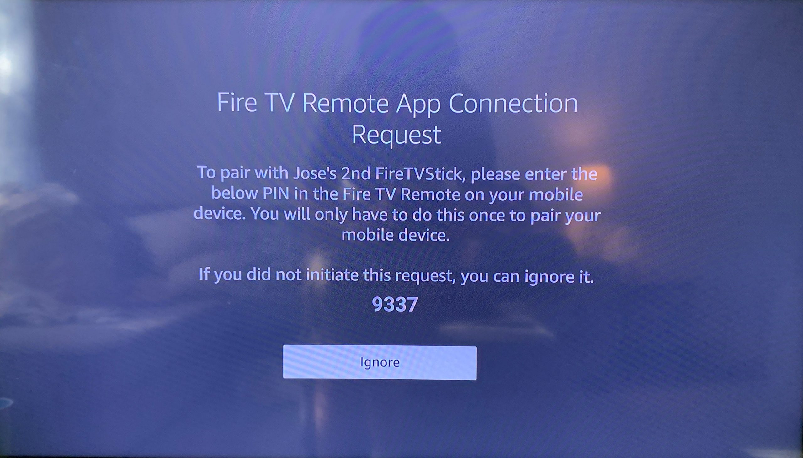 An Amazon Fire TV device displaying a code that the user can enter onto their phone to use the phone as a remote control.