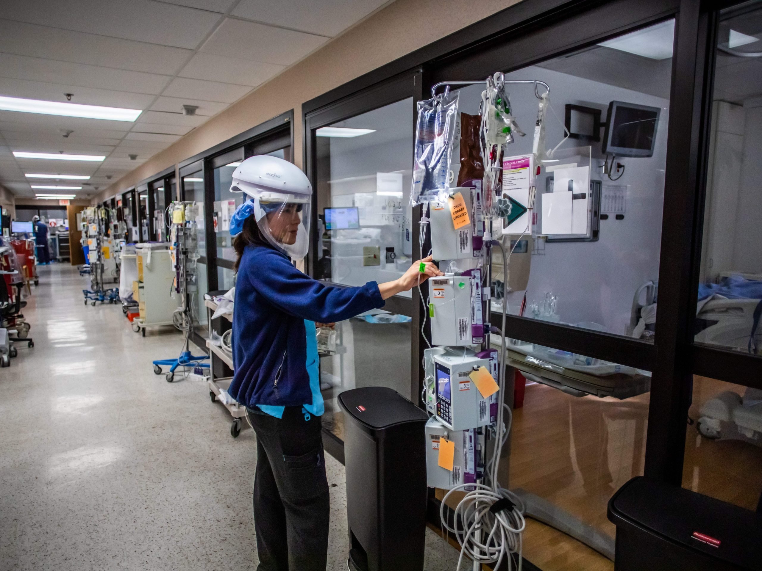 Registered nurse Yeni Sandoval manages medication for a Covid-19 patient in the Intensive Care Unit (ICU) at Providence Cedars-Sinai Tarzana Medical Center in Tarzana, California on January 3, 2021.