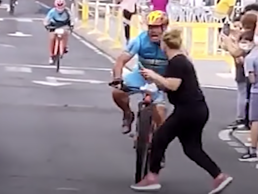 A woman causing a crash at a Spanish cycling event.