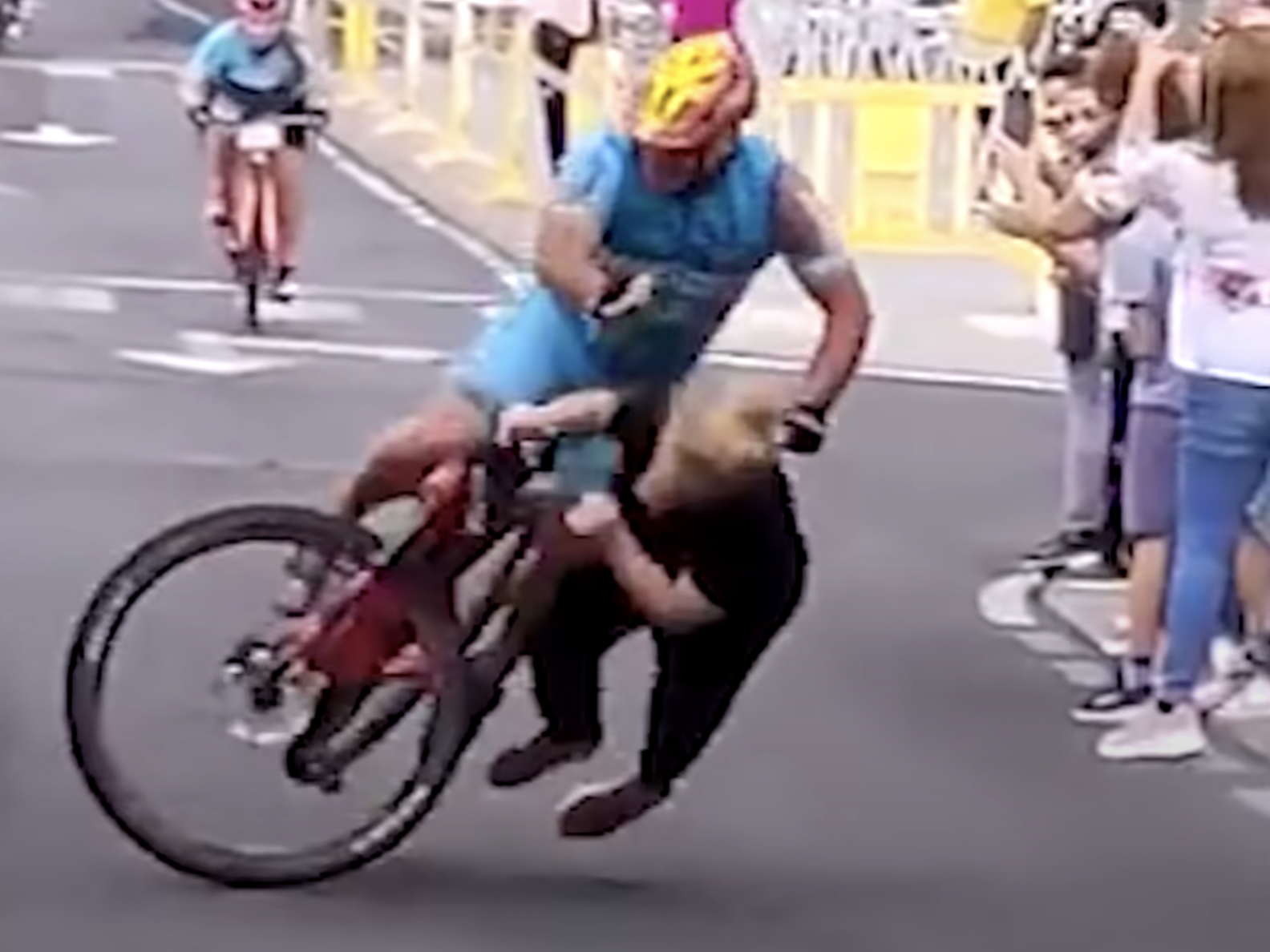 A woman causing a crash at a Spanish cycling event.