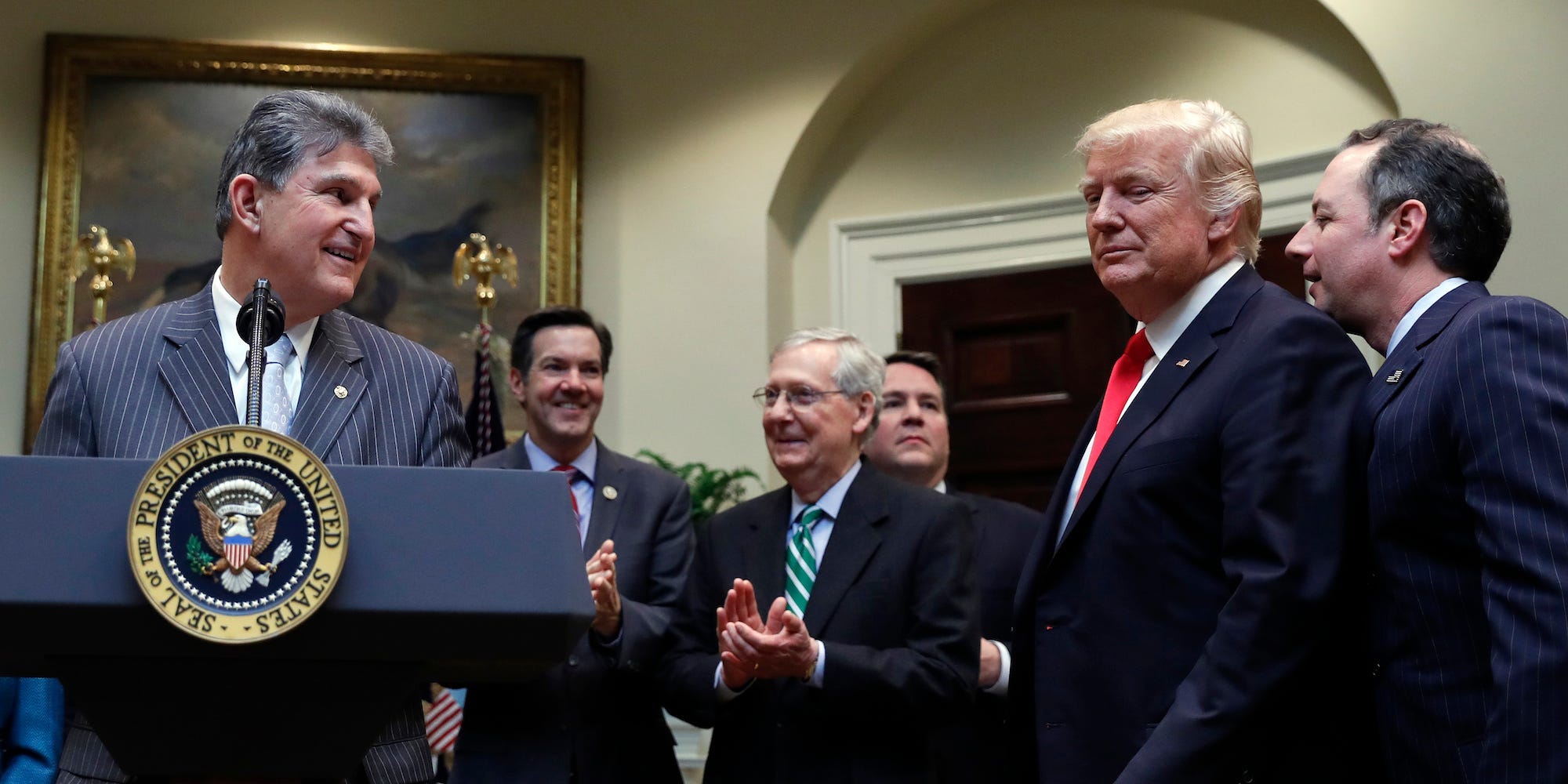 Democratic Sen. Joe Manchin of West Virginia speaks during a bill signing ceremony at the White House with former President Donald Trump on Thursday, Feb. 16, 2017.