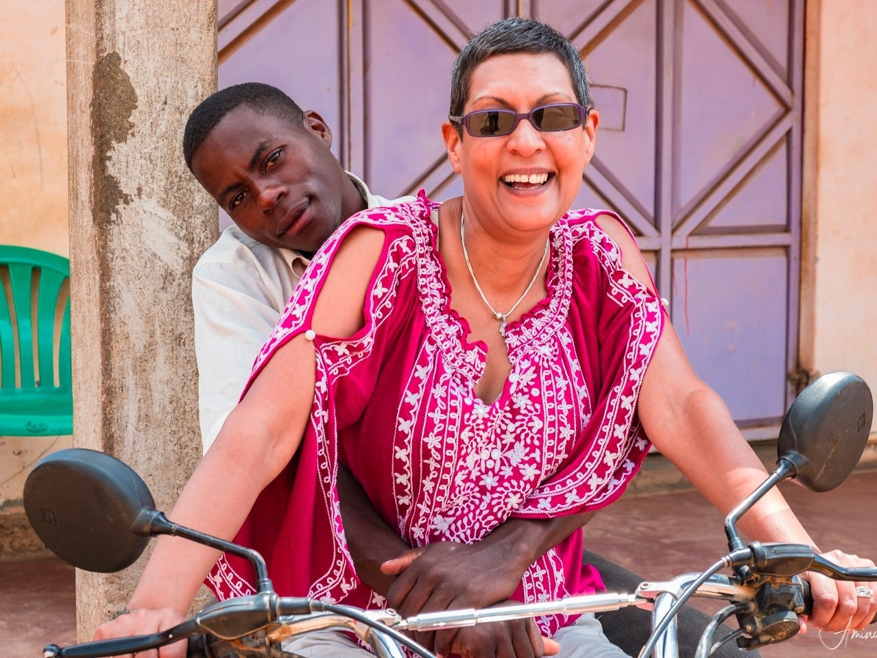 women on a motorcycle with a man on the back