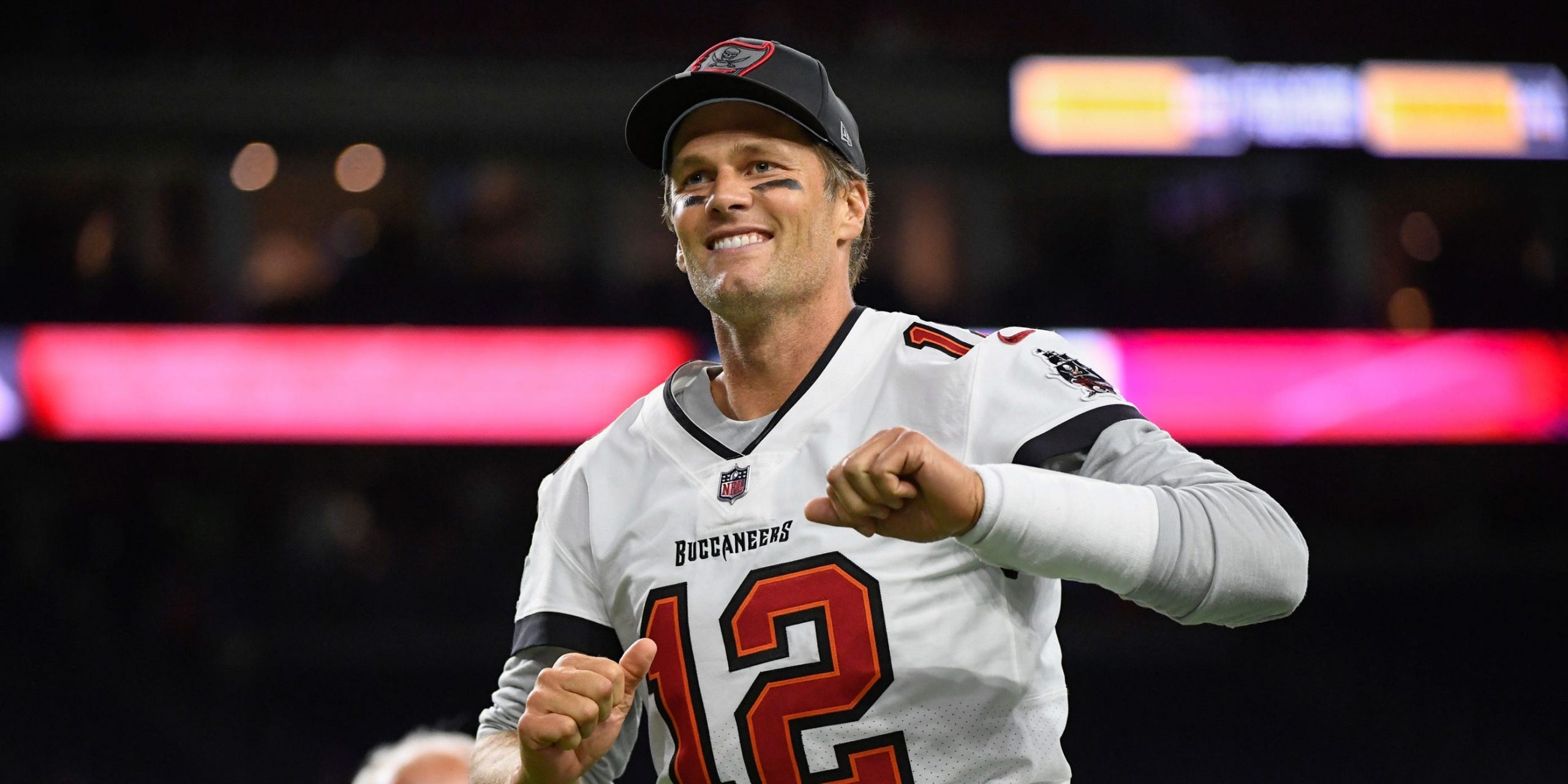 Tom Brady walks off the field after a preseason game.