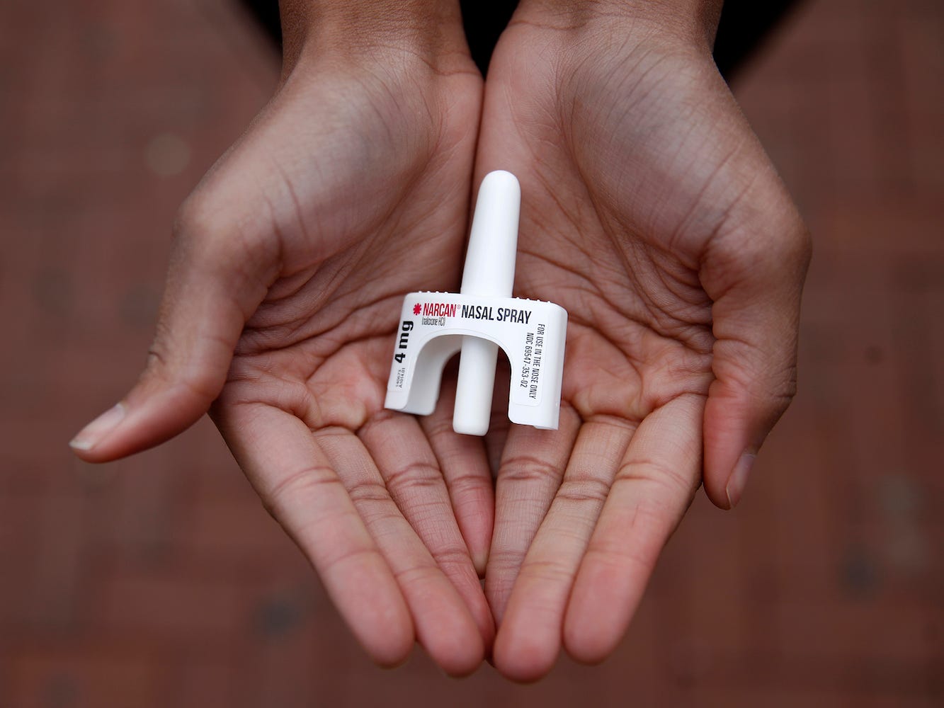 In this Jan. 23, 2018, file photo, Leah Hill, a behavioral health fellow with the Baltimore City Health Department, displays a sample of Narcan nasal spray in Baltimore. The overdose-reversal drug is a critical tool to easing America's coast-to-coast opioid epidemic. A record 621 people died of drug overdoses in San Francisco so far in 2020, a staggering number that far outpaces the 173 deaths from COVID-19 the city has seen thus far. The crisis fueled by the powerful painkiller Fentanyl could have been far worse if it wasn't for the nearly 3,000 times Narcan was used from January to the beginning of November to save someone from the brink of death, the San Francisco Chronicle reported Saturday, Dec. 19, 2020