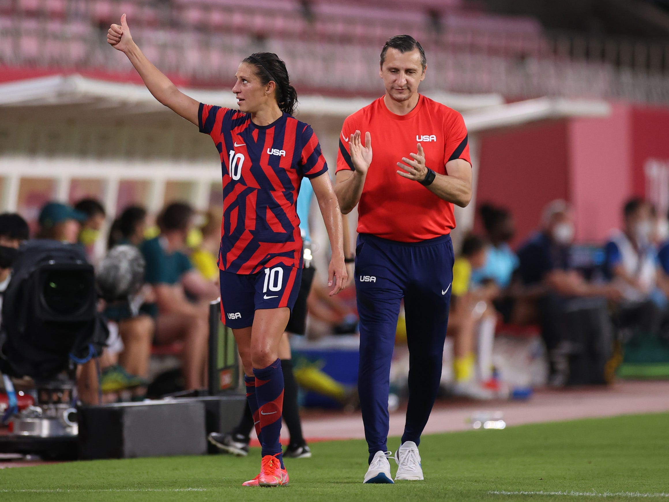 Carli Lloyd and Vlatko Andonovski.