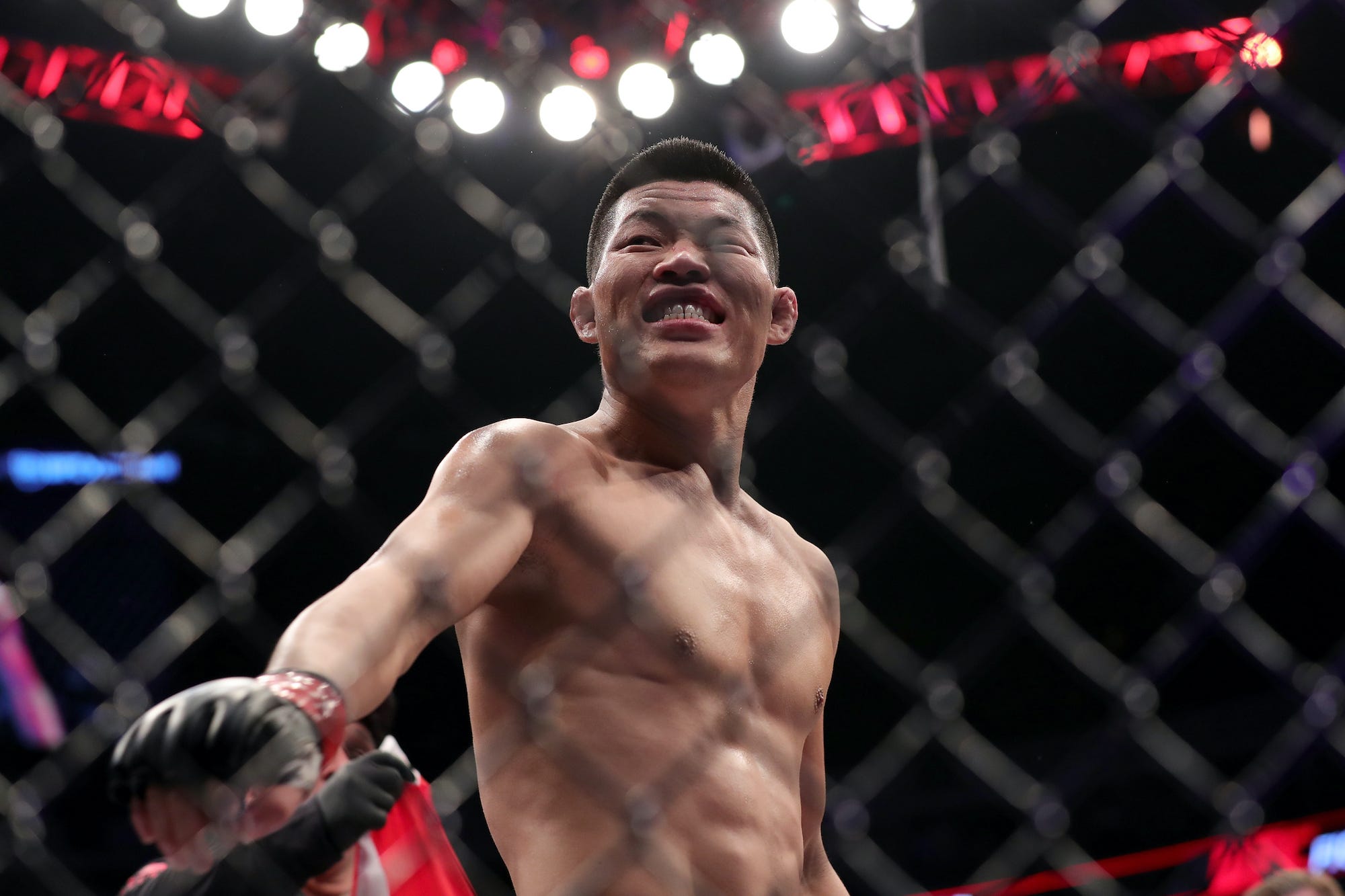 Li Jingliang celebrates a recent win inside the UFC Octagon.
