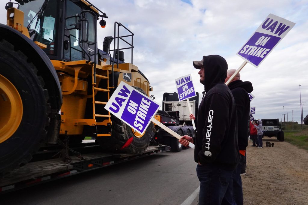 I'm striking at John Deere. We're tired of layoffs and benefit losses