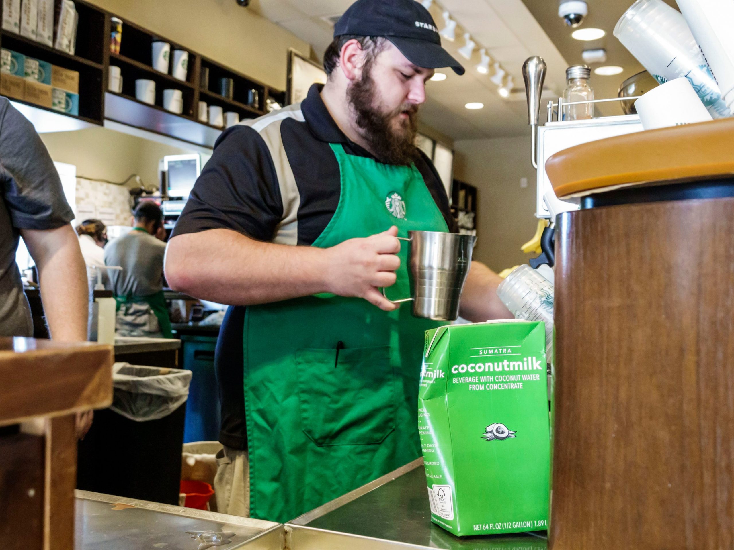 A Starbucks barista makes coffee in Florida.