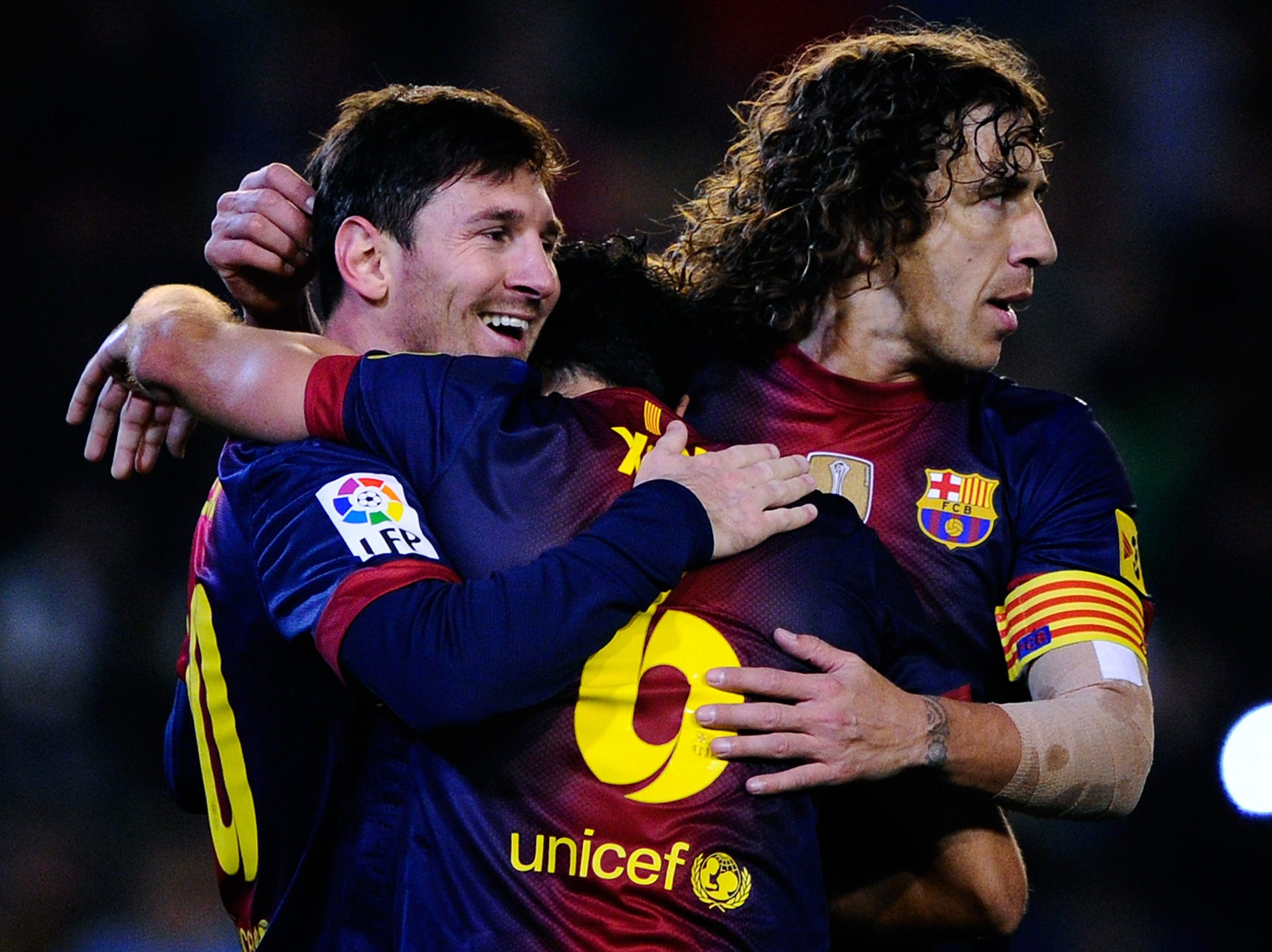 Lionel Messi, Xavi and Carles Puyol