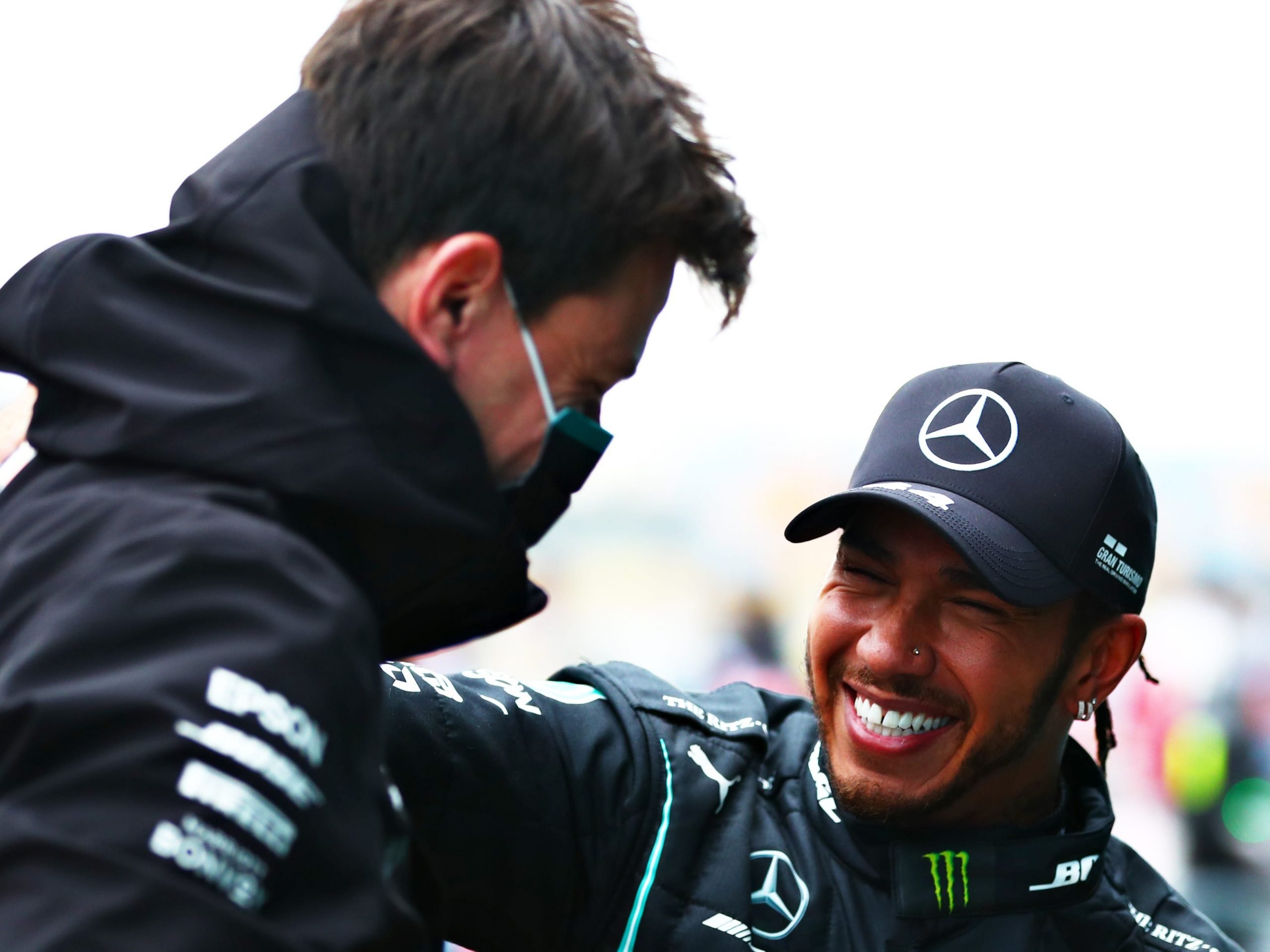 Lewis Hamilton smiles at Toto Wolff