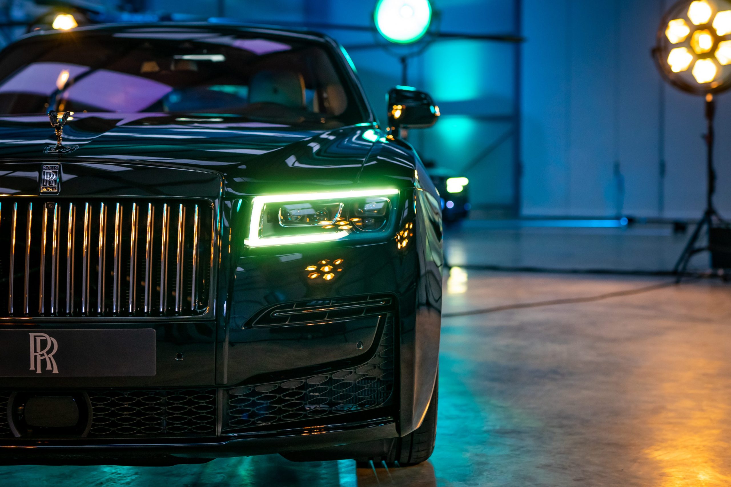 The Rolls-Royce Ghost Black Badge at night.