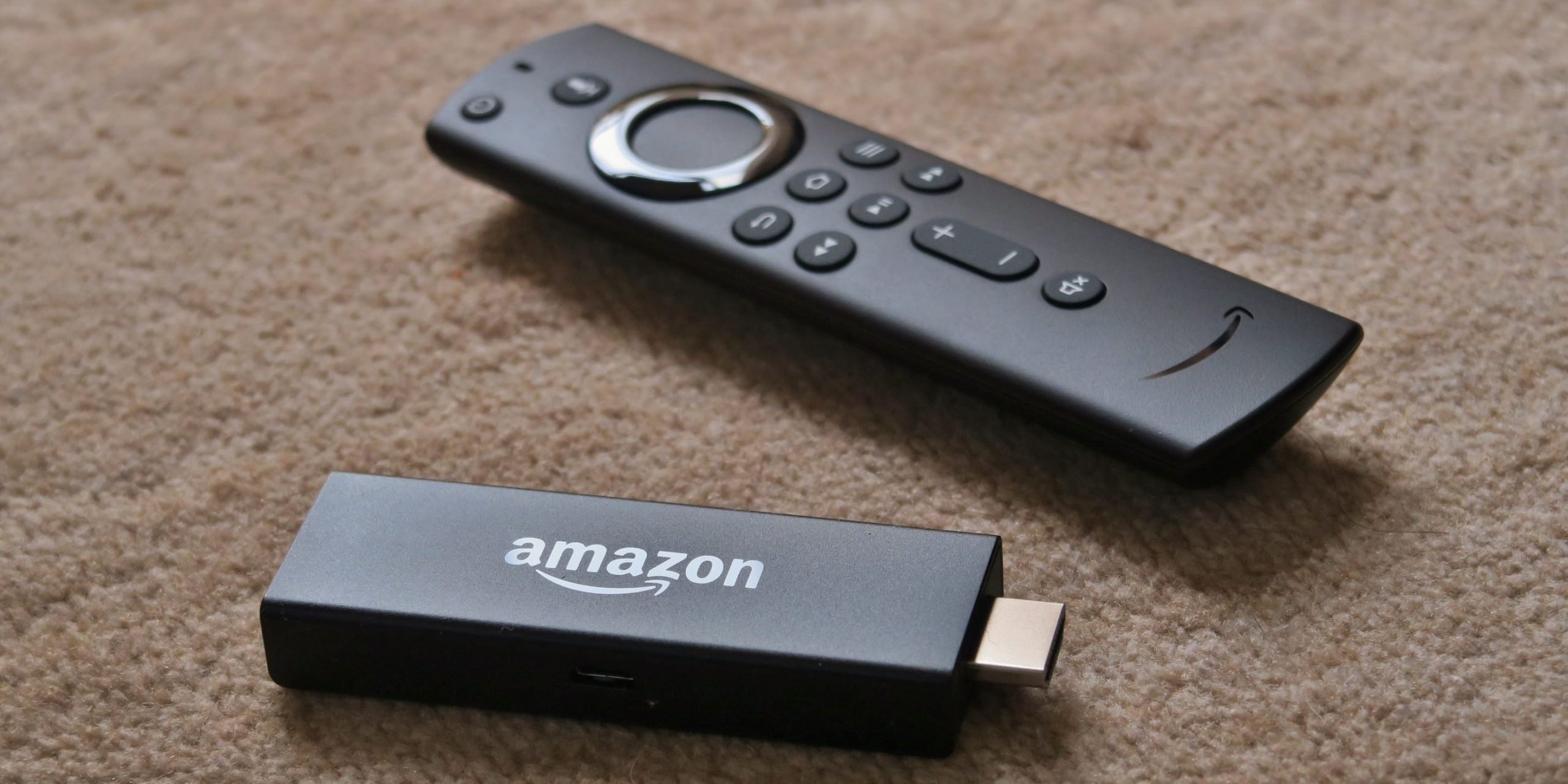 An Amazon Fire TV Stick and remote.