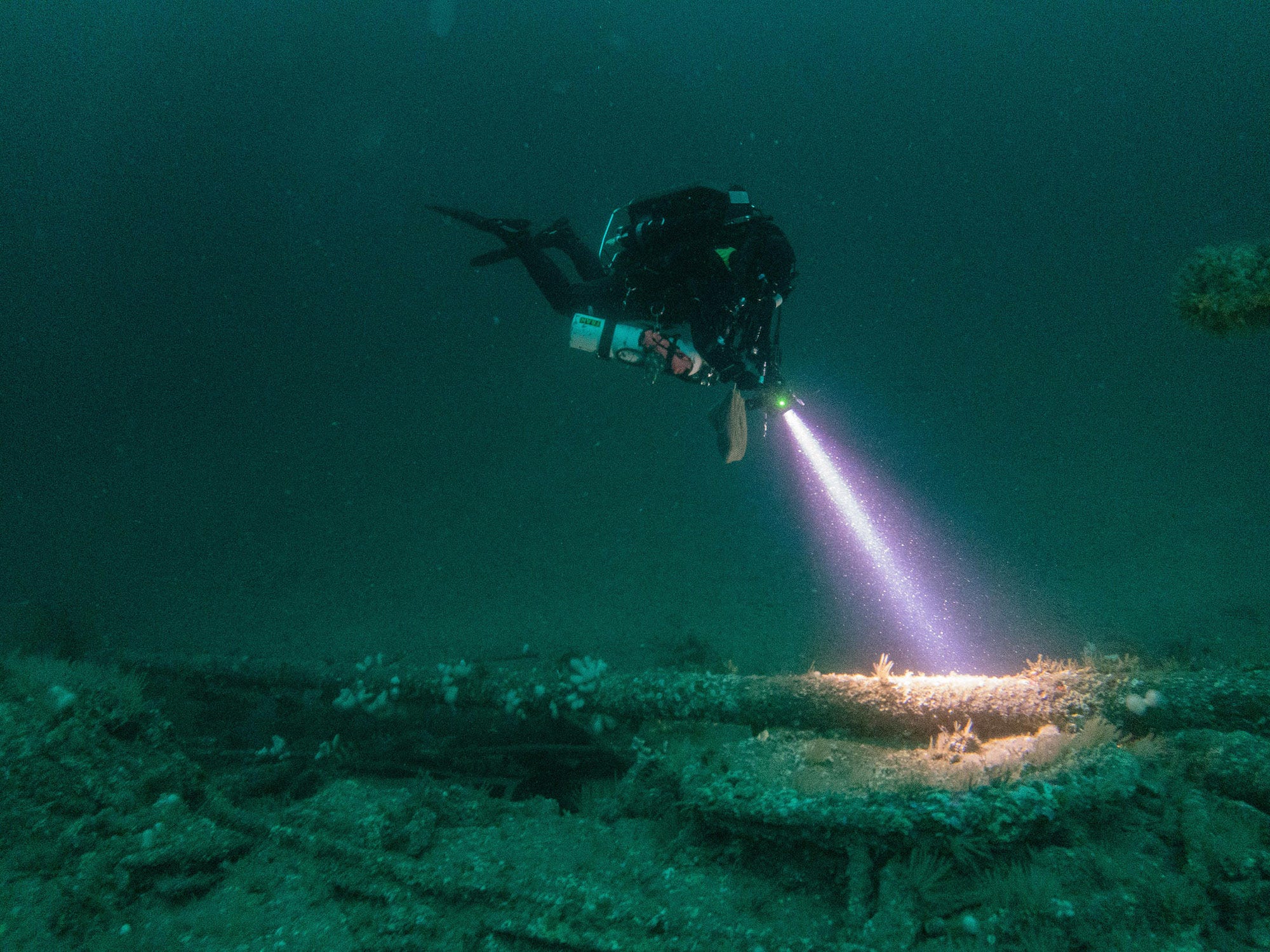 Diver inspects U-boat wreck