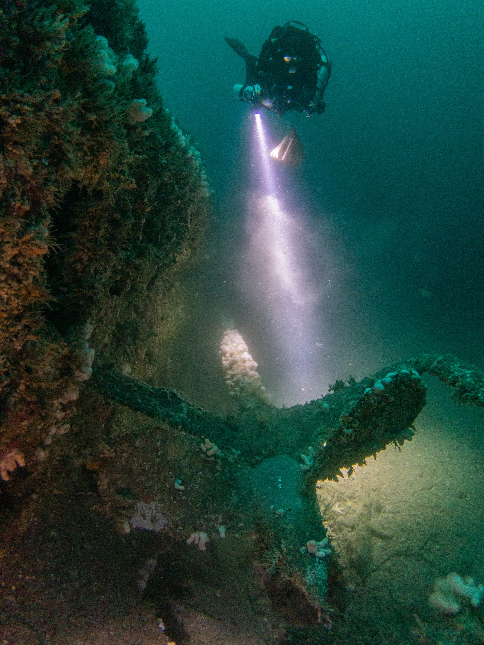 A diver inspects U-boat wreckage in the English Channel