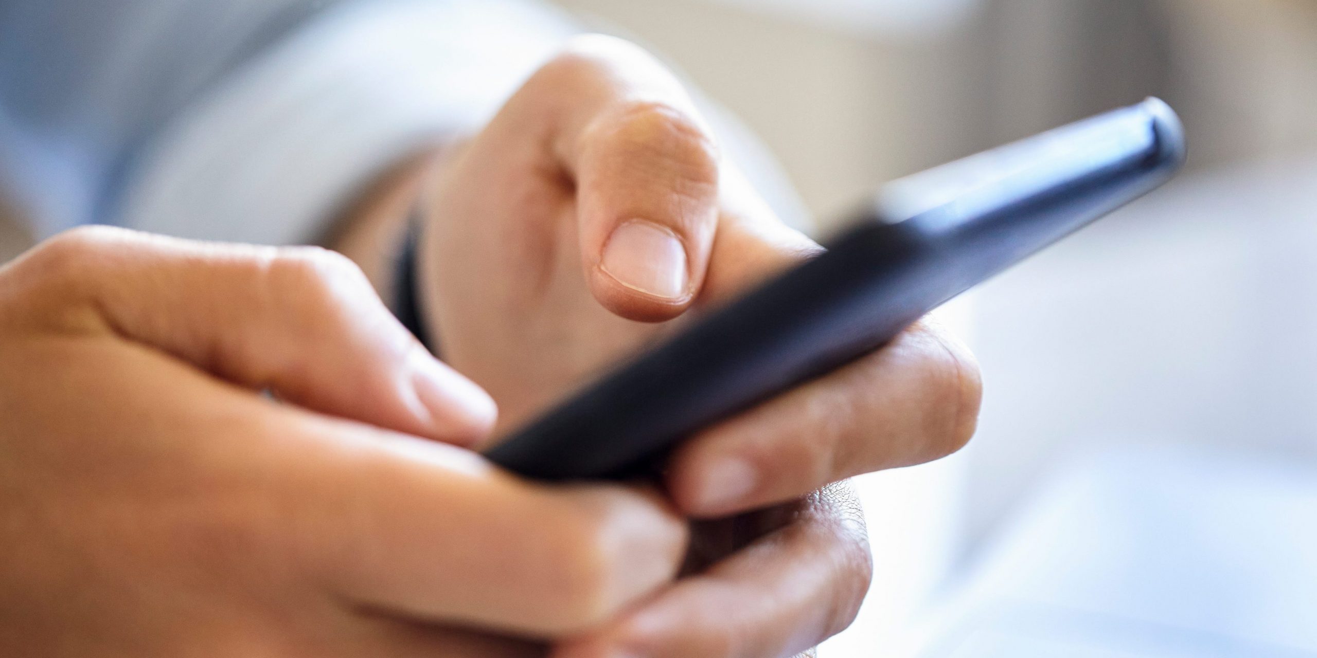 Image of a phone in a pair of hands