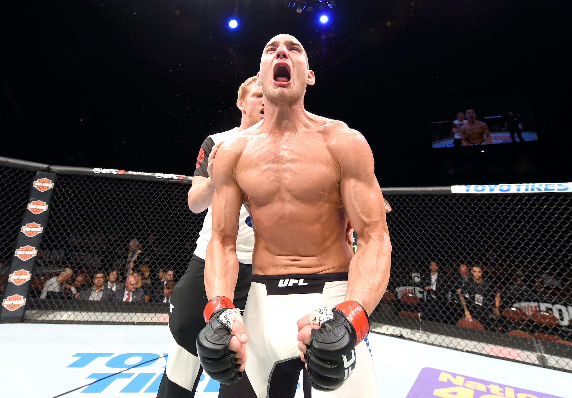 Sean Strickland celebrates a 2016 victory in the UFC.