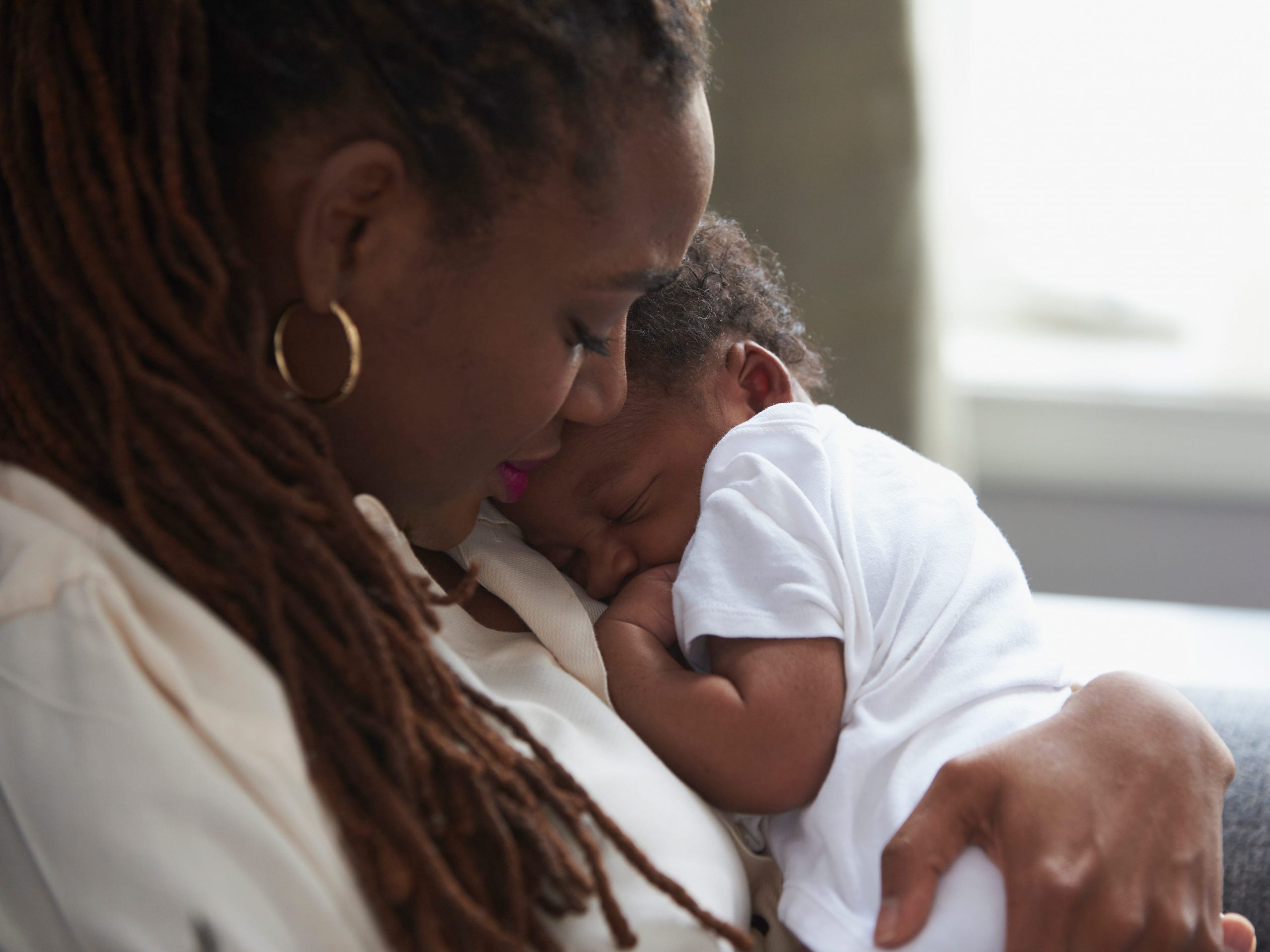 newborn baby with mother