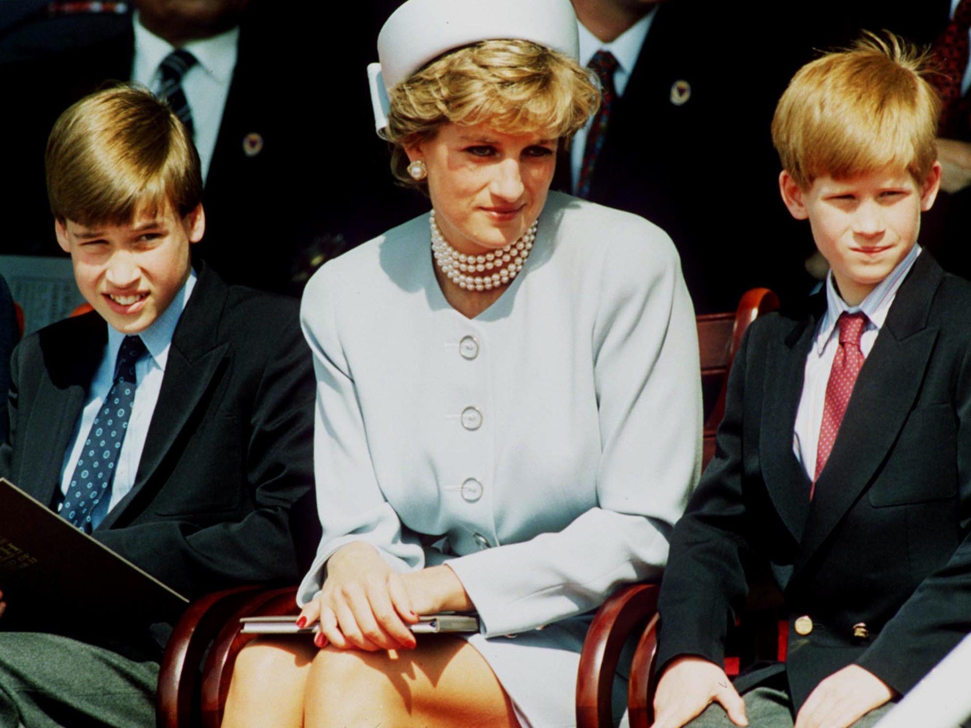 Princess Diana, Princess of Wales with her sons Prince William and Prince Harry attend the Heads of State VE Remembrance Service in Hyde Park in 1995.