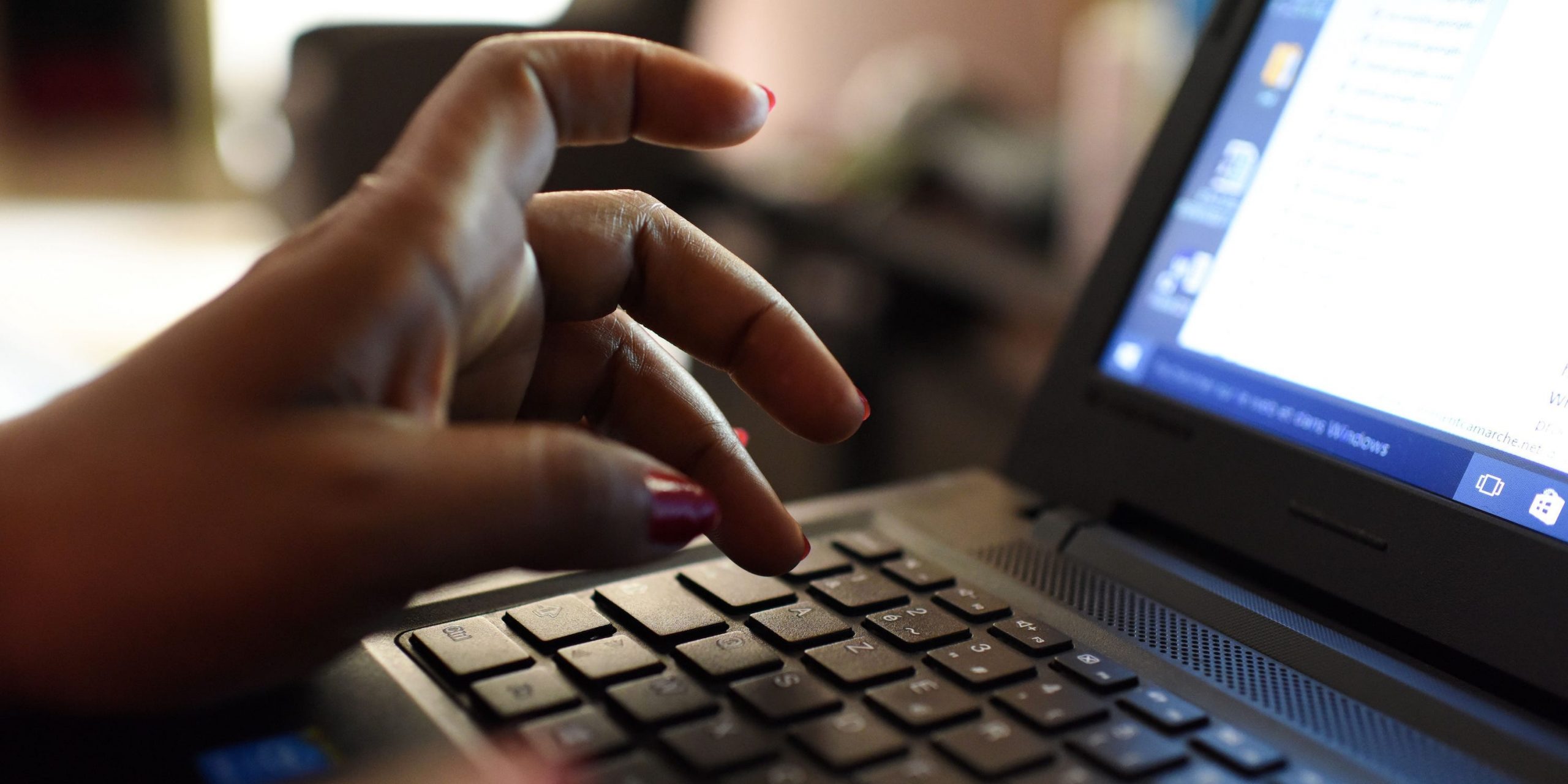 woman uses laptop