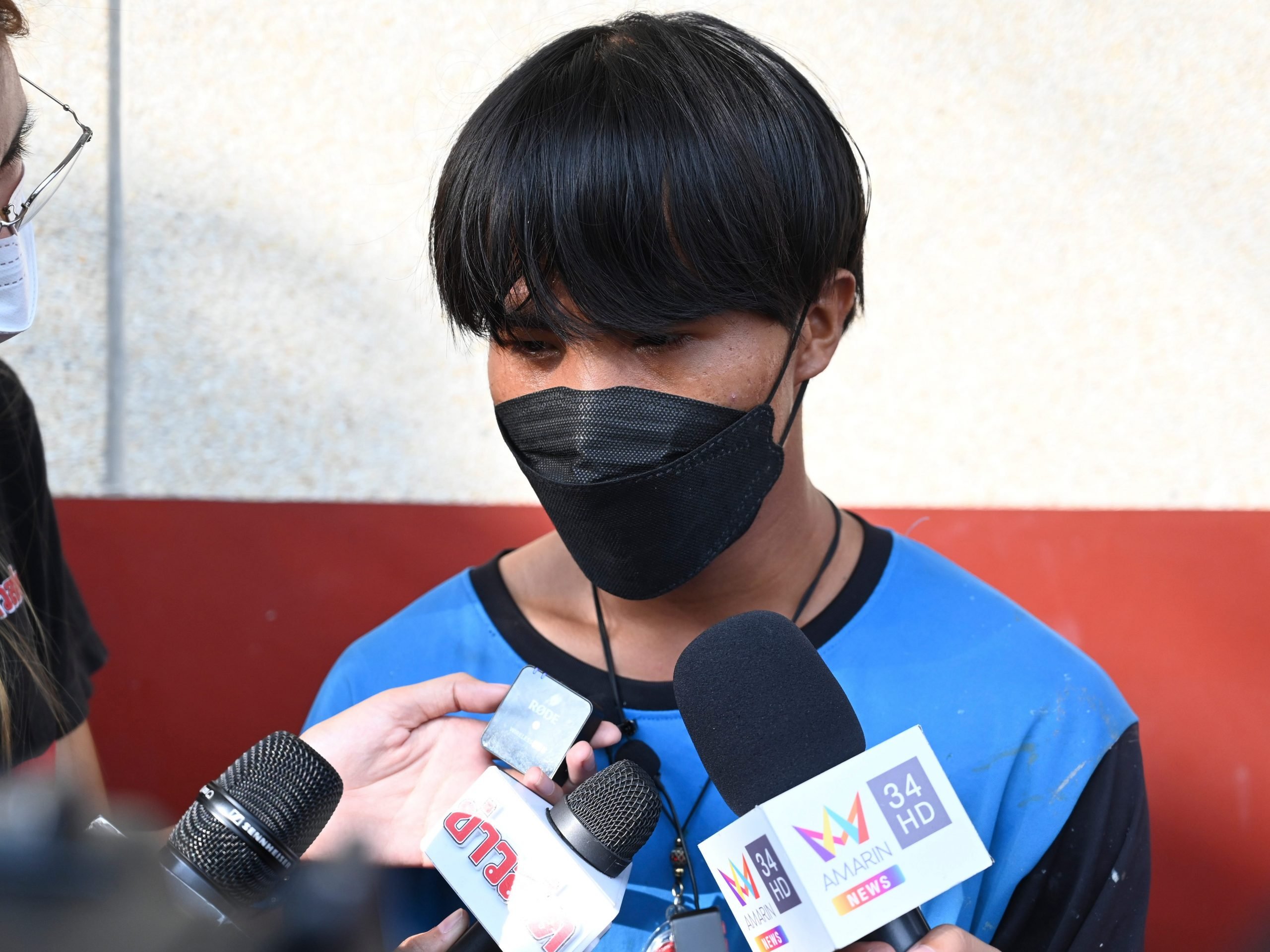 A Myanmar national identified as Song, one of two painters rescued from a high-rise condominium in Thailand, talks to reporters at Pak Kret police station in Nonthaburi near Bangkok, Wednesday, Oct. 27, 2021.