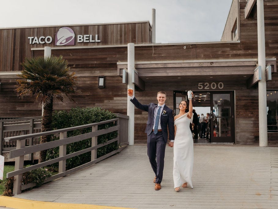 A just-married couple leaves their wedding reception at Taco Bell Cantina Pacifica.