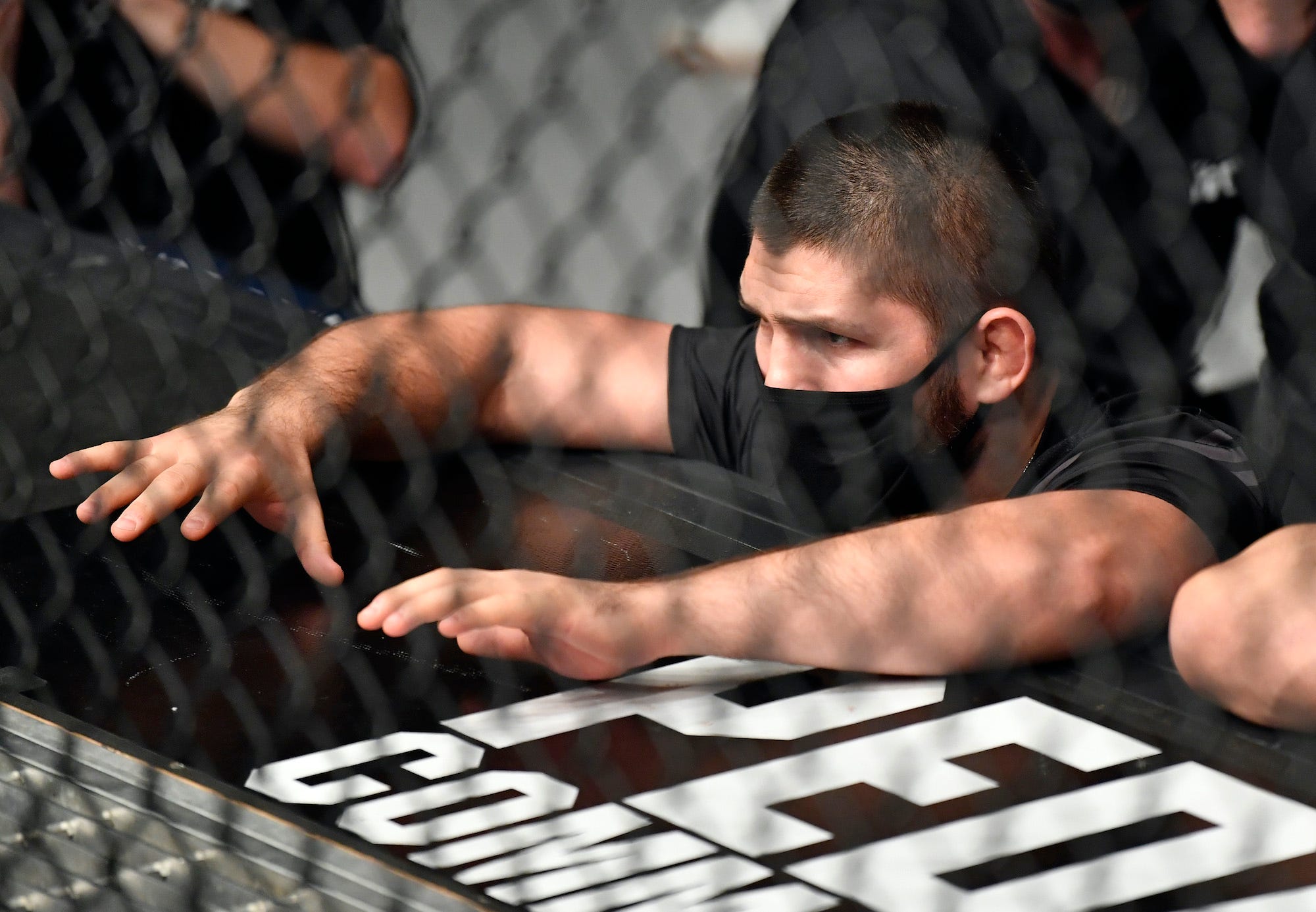 Khabib Nurmagomedov coaching Islam Makhachev at UFC 267.